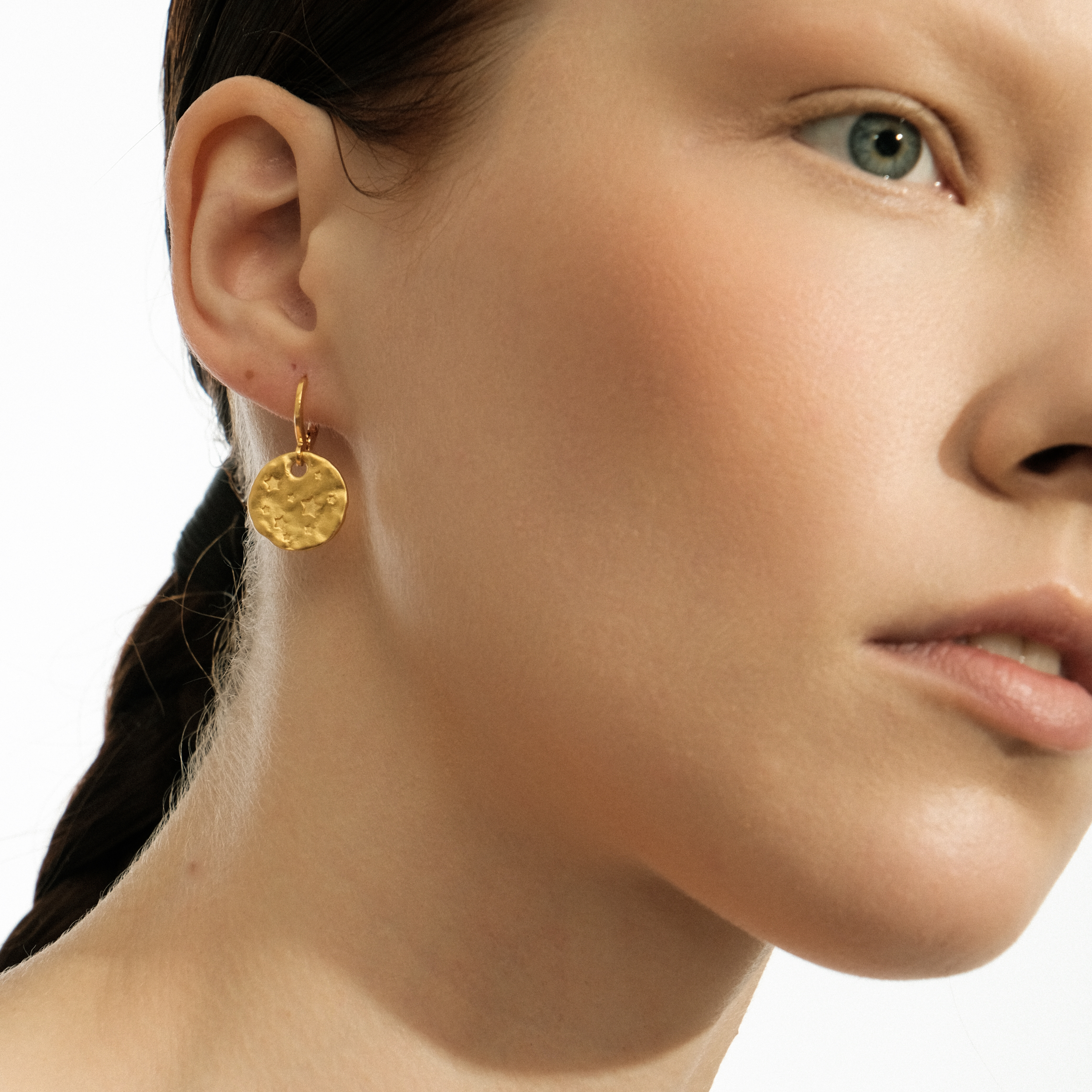 Gold-plated earrings with small coins with stars