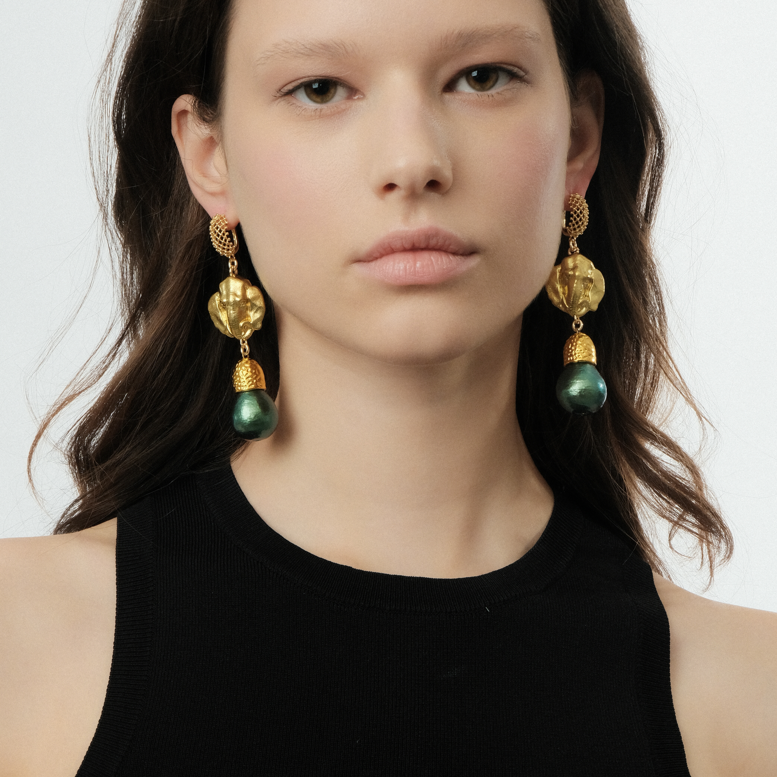 Golden elephant head earrings and green pearls