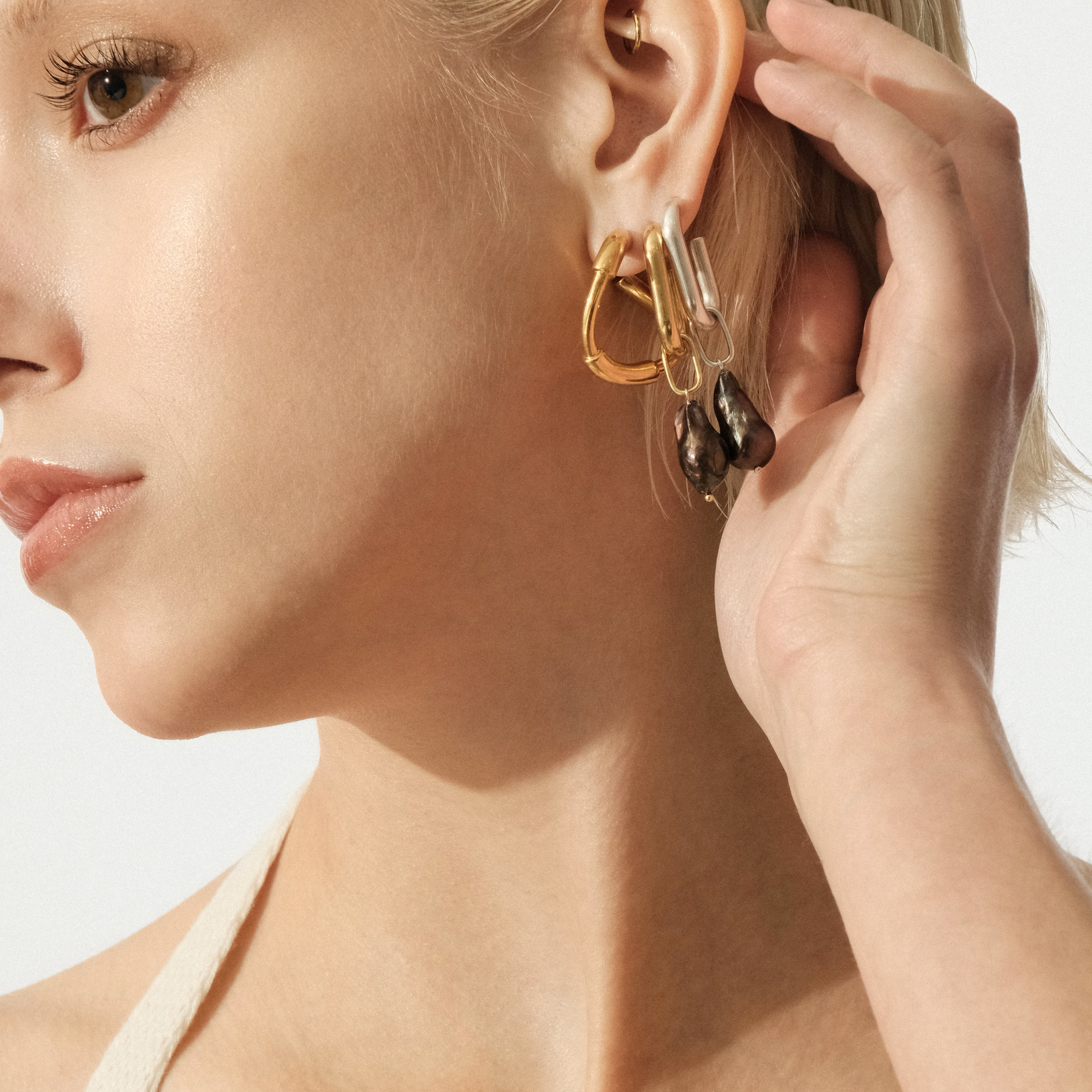 Golden M monoser with pendant