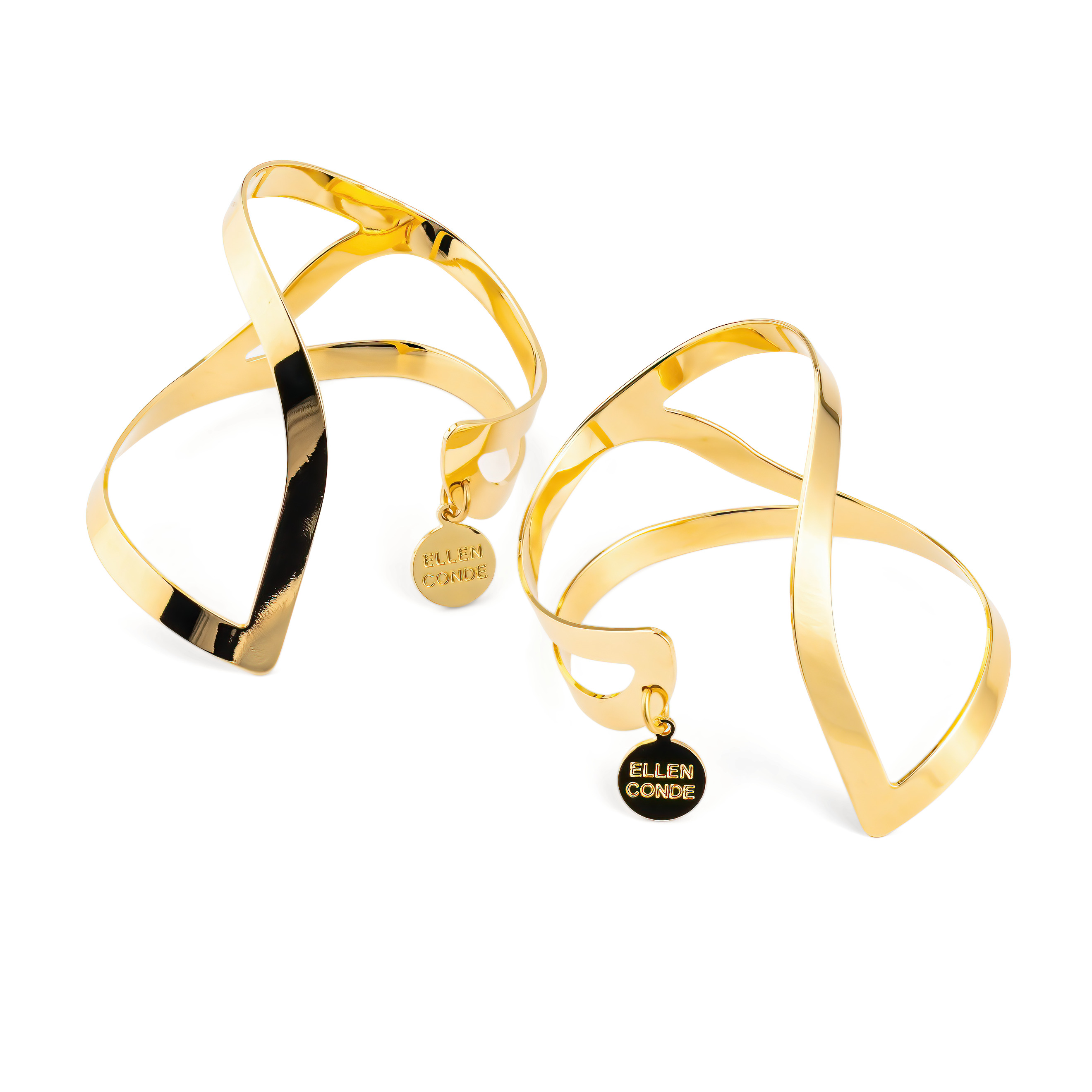 A pair of symmetrical gold-plated adjustable wrist bracelets