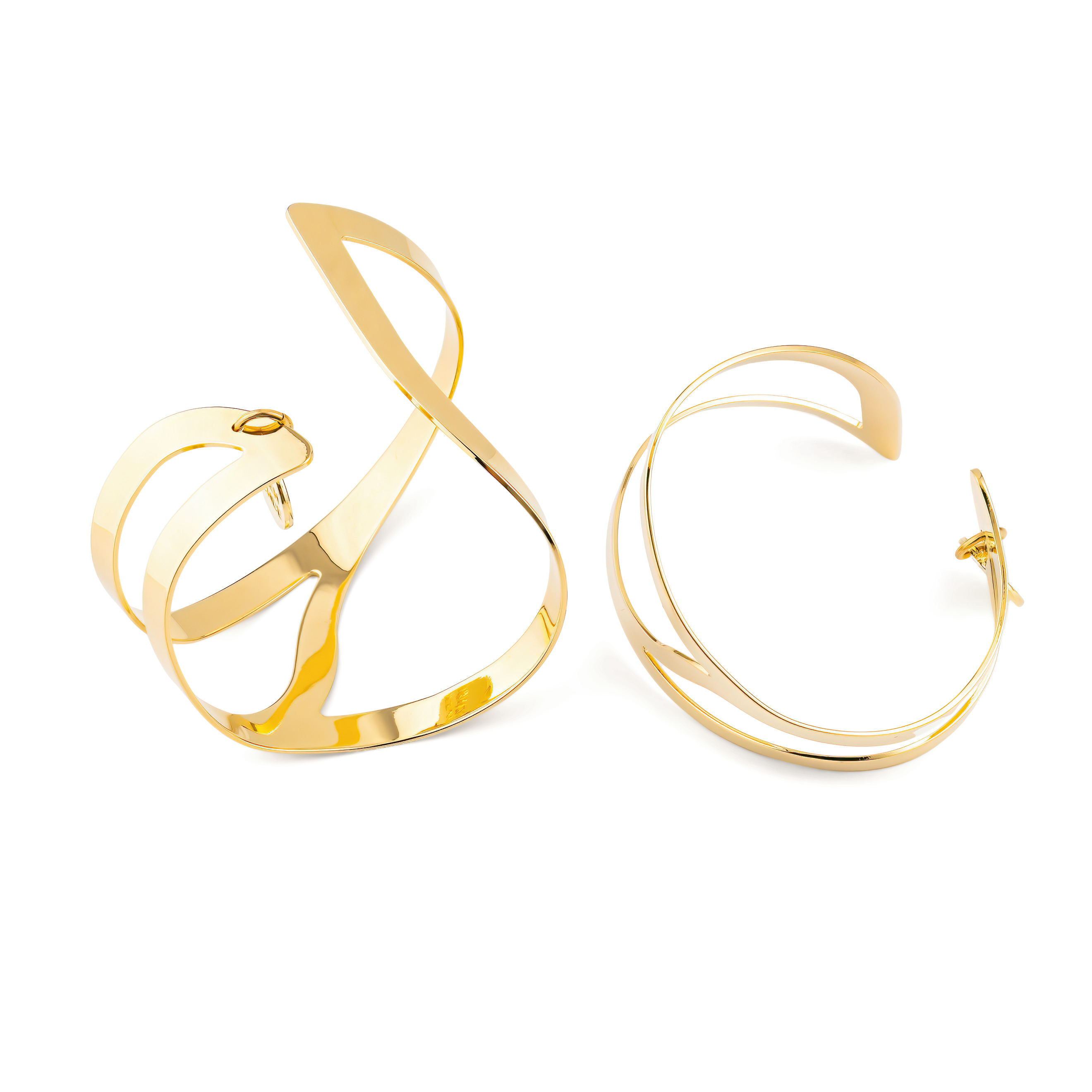 A pair of symmetrical gold-plated adjustable wrist bracelets