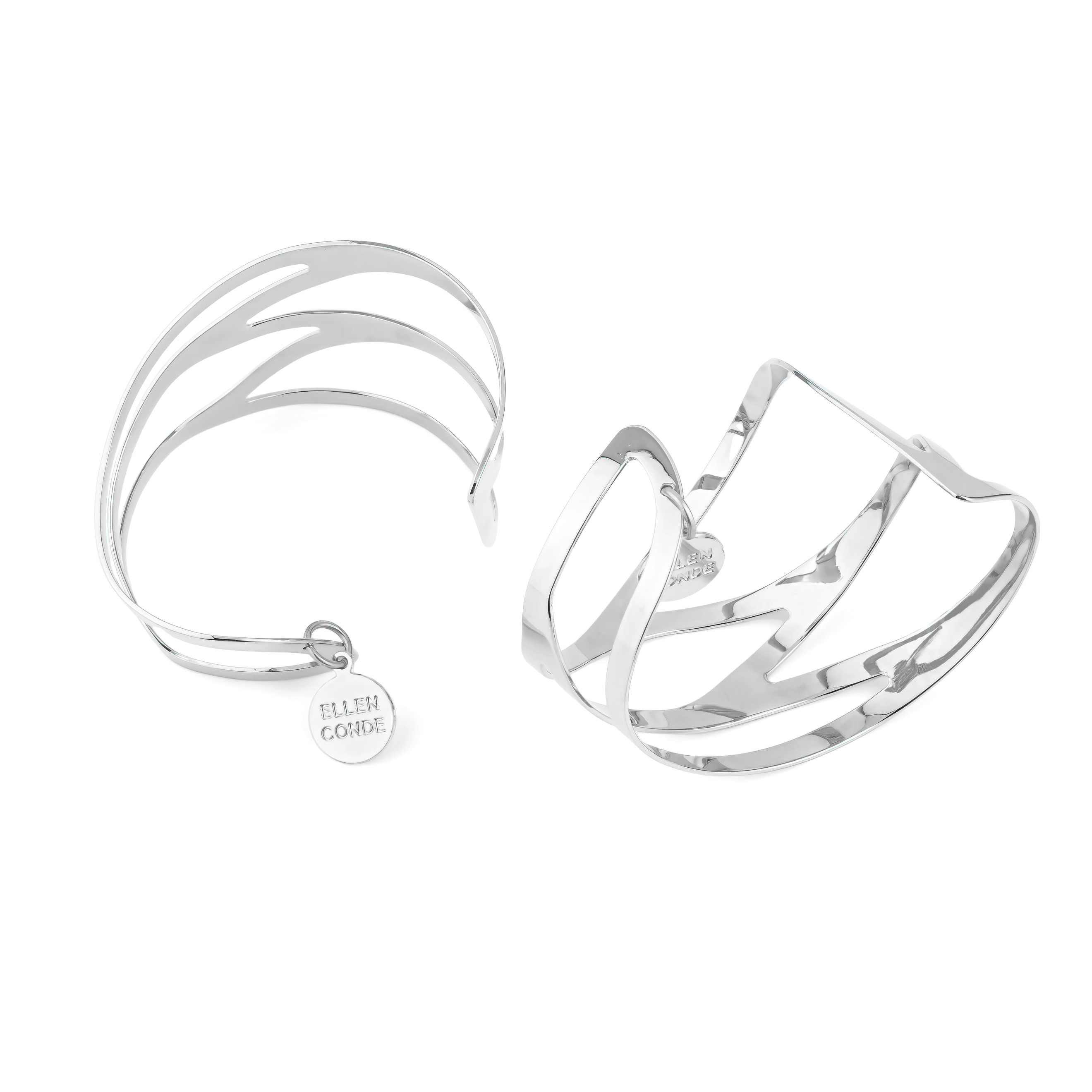 A pair of symmetrical adjustable silver dragonfly bracelets on the wrist