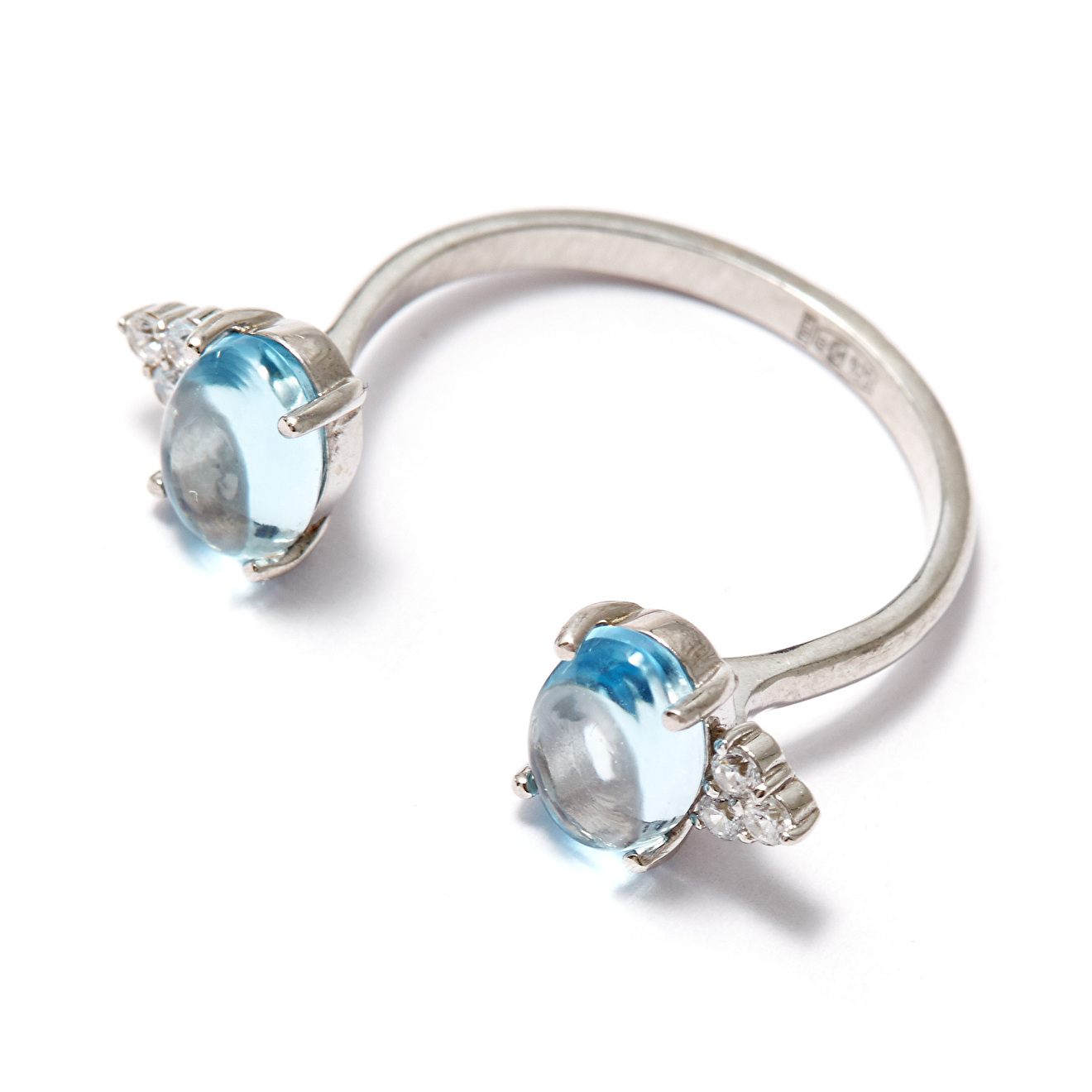 Open silver ring with blue topaz