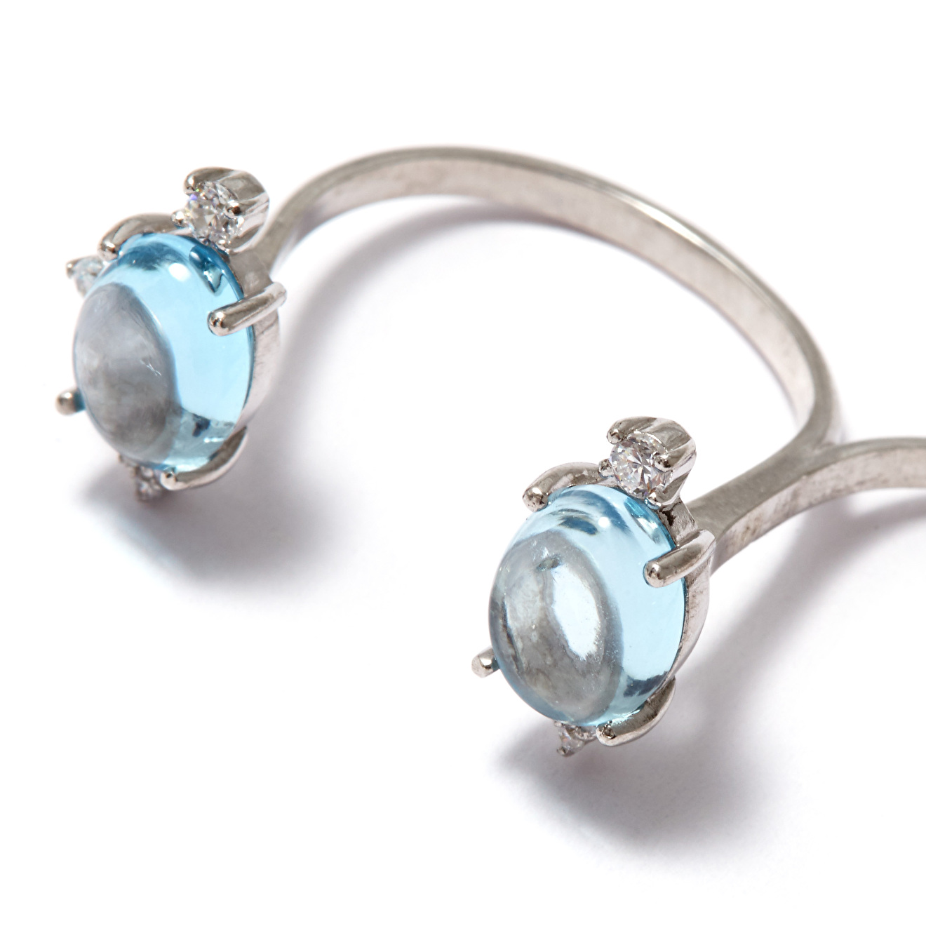 Silver two-finger ring with blue topaz