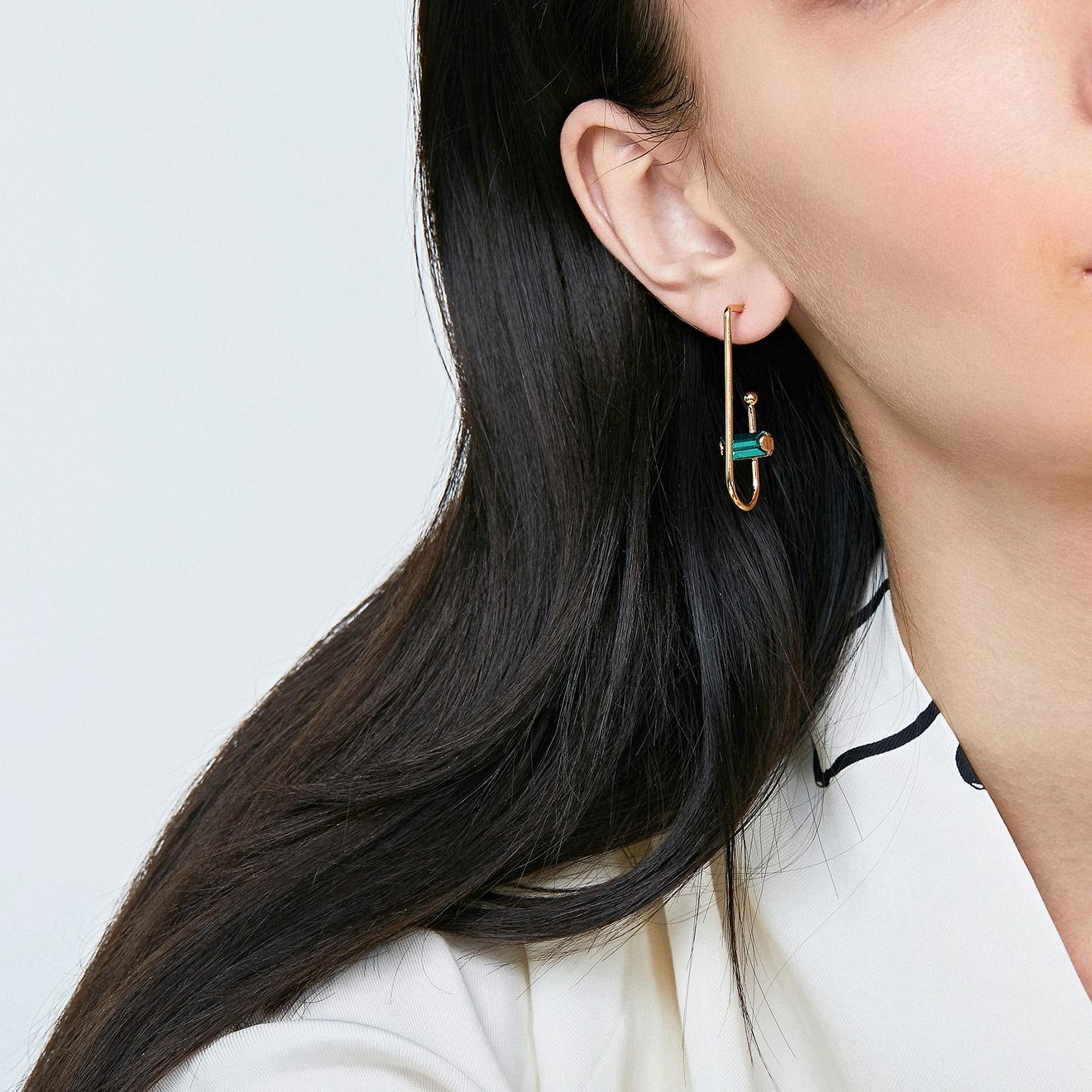 arc earrings with green crystals