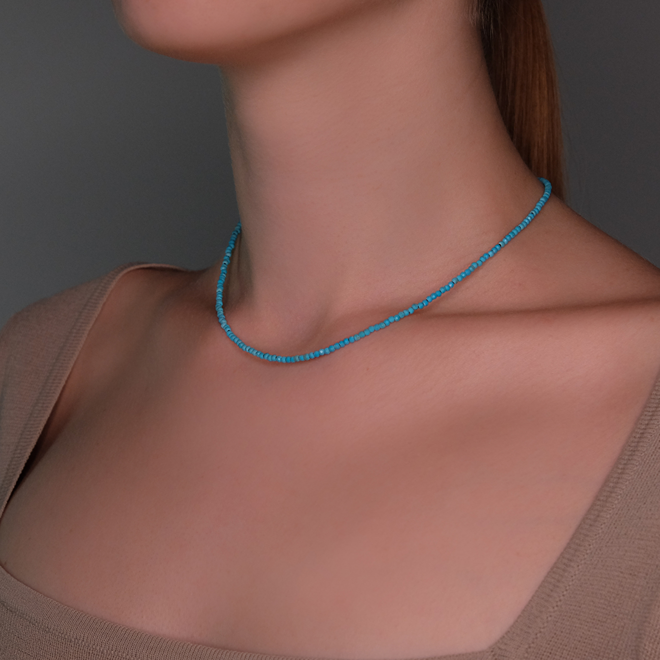 A thin thread of silver with turquoise