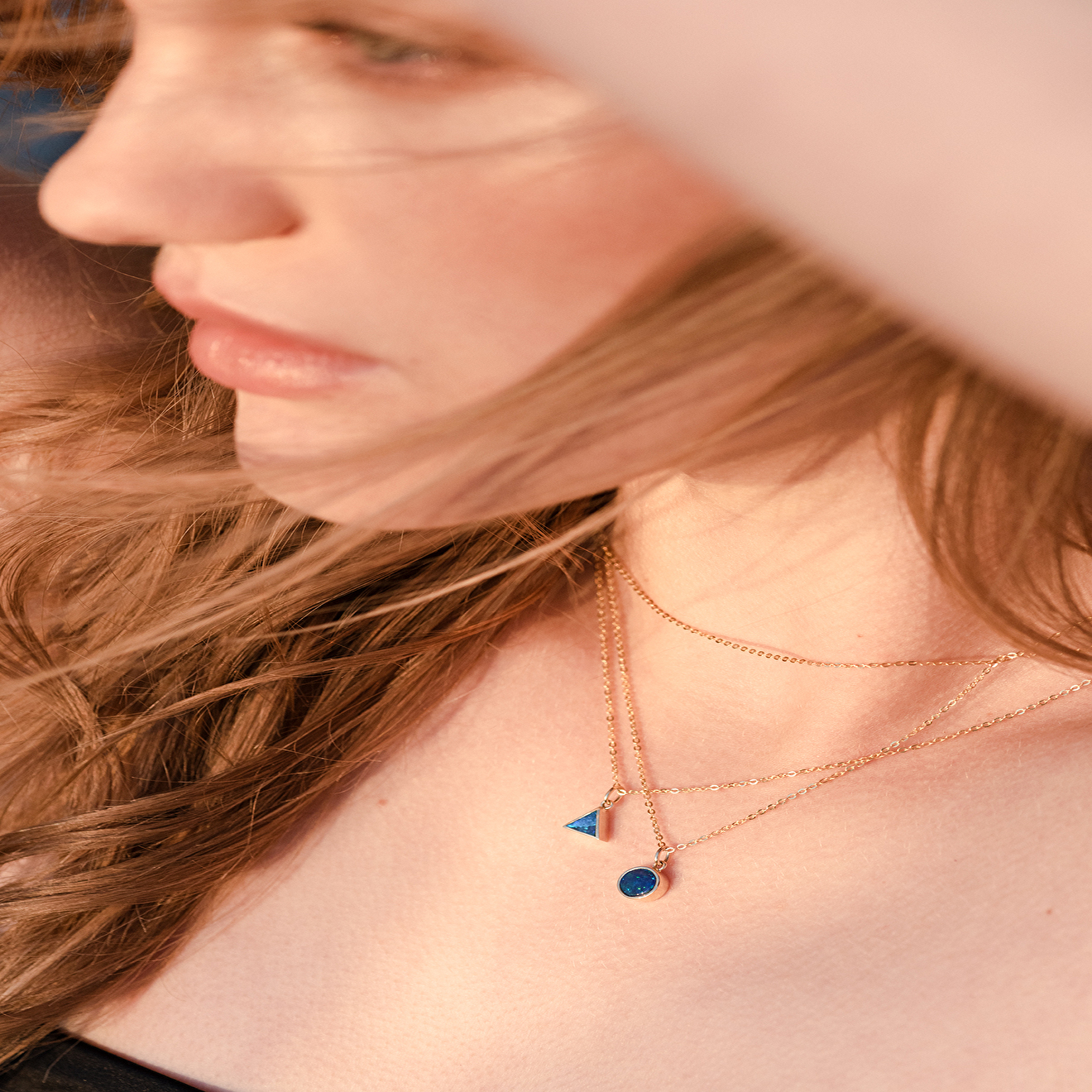 Triangle necklace made of gold with opal