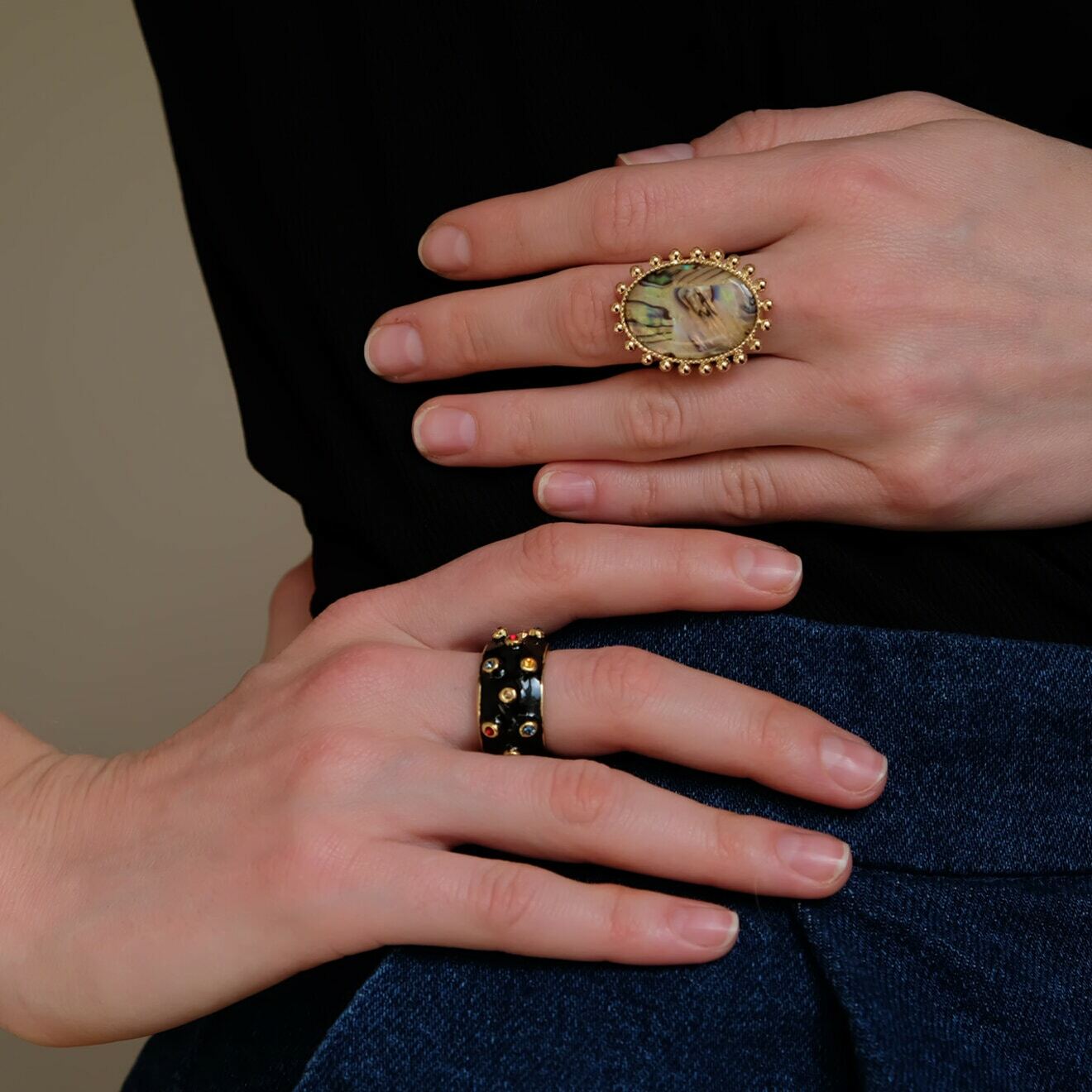 Golden-black ring with colored crystals
