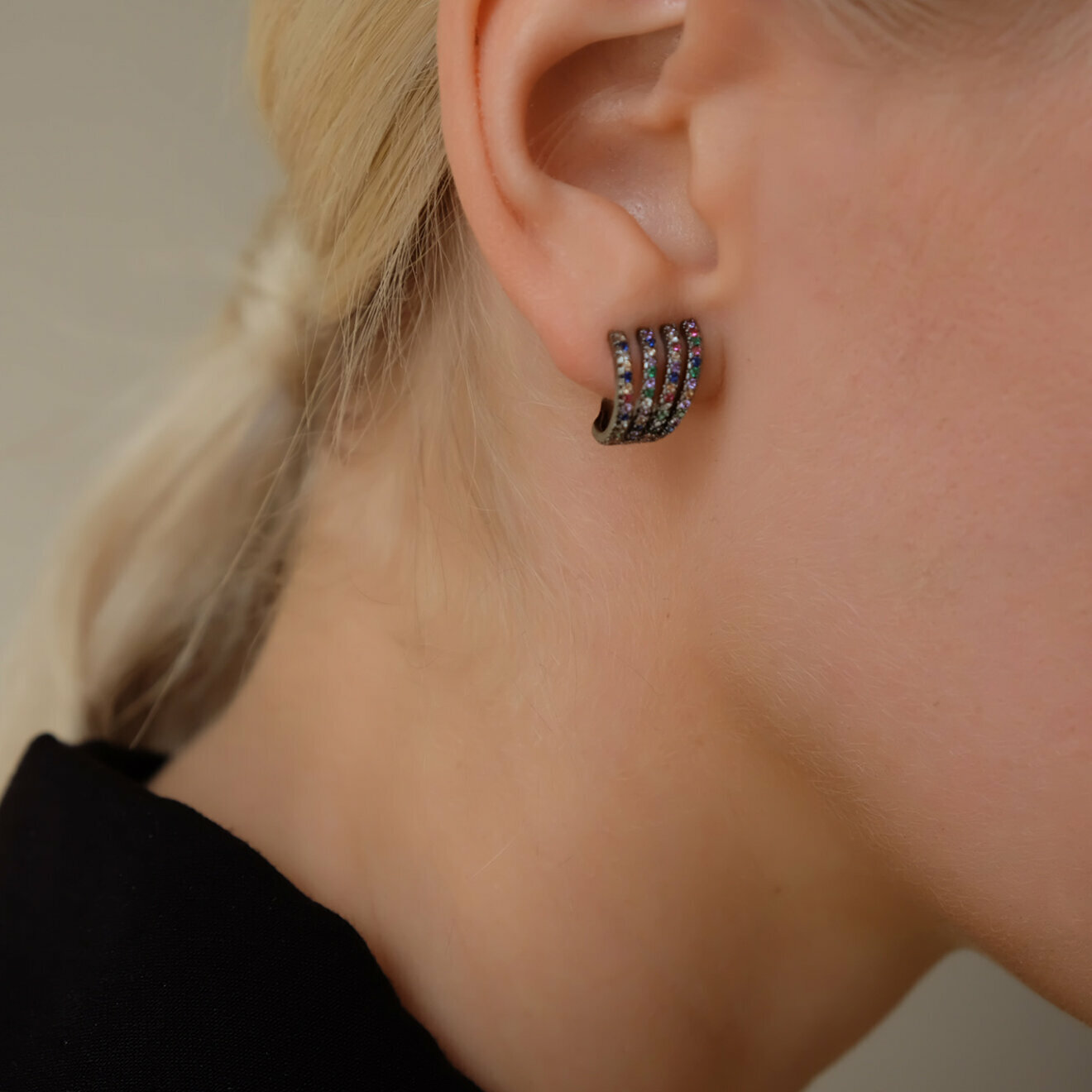 Blackened cuffs with colored crystals
