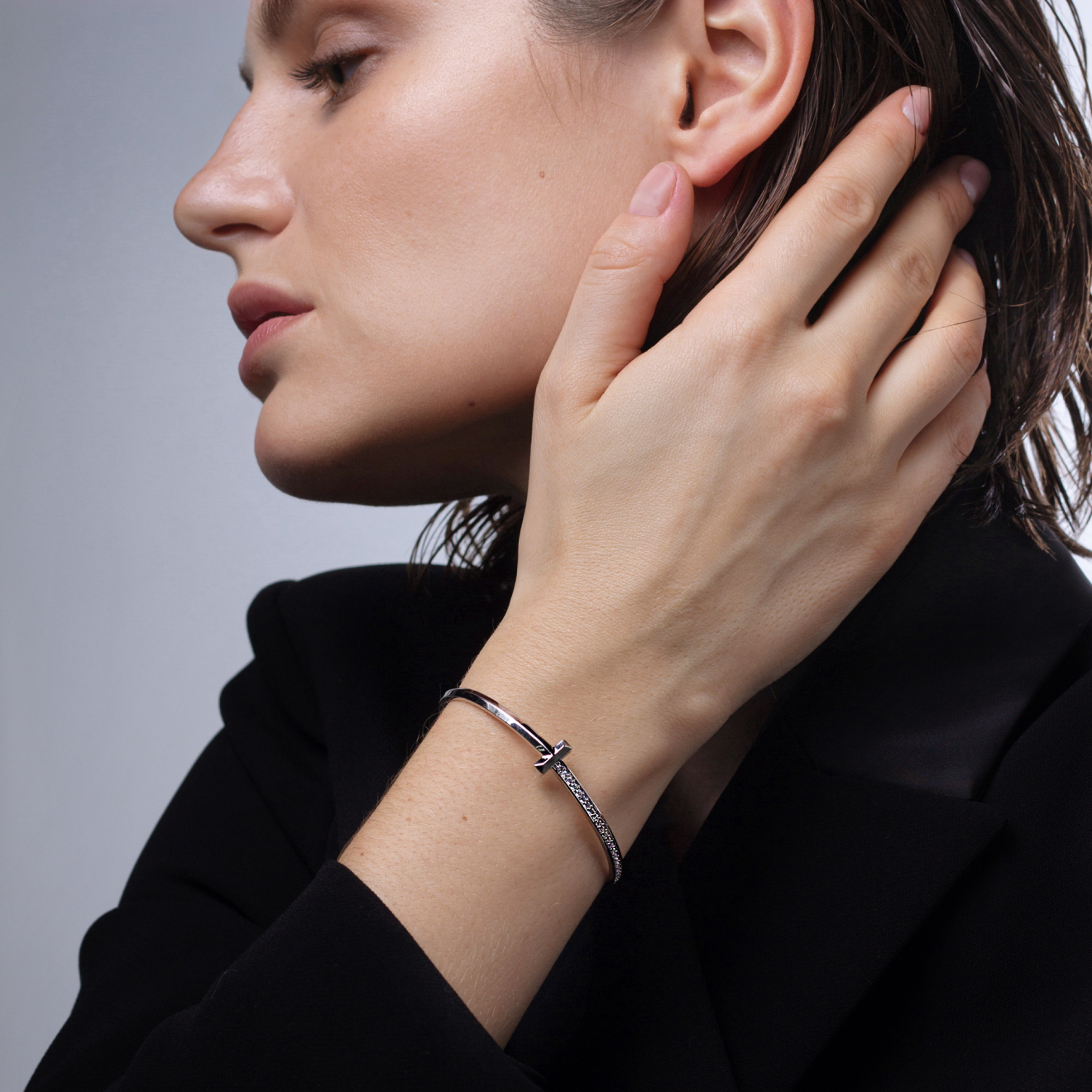 Silver hard bracelet with crystals