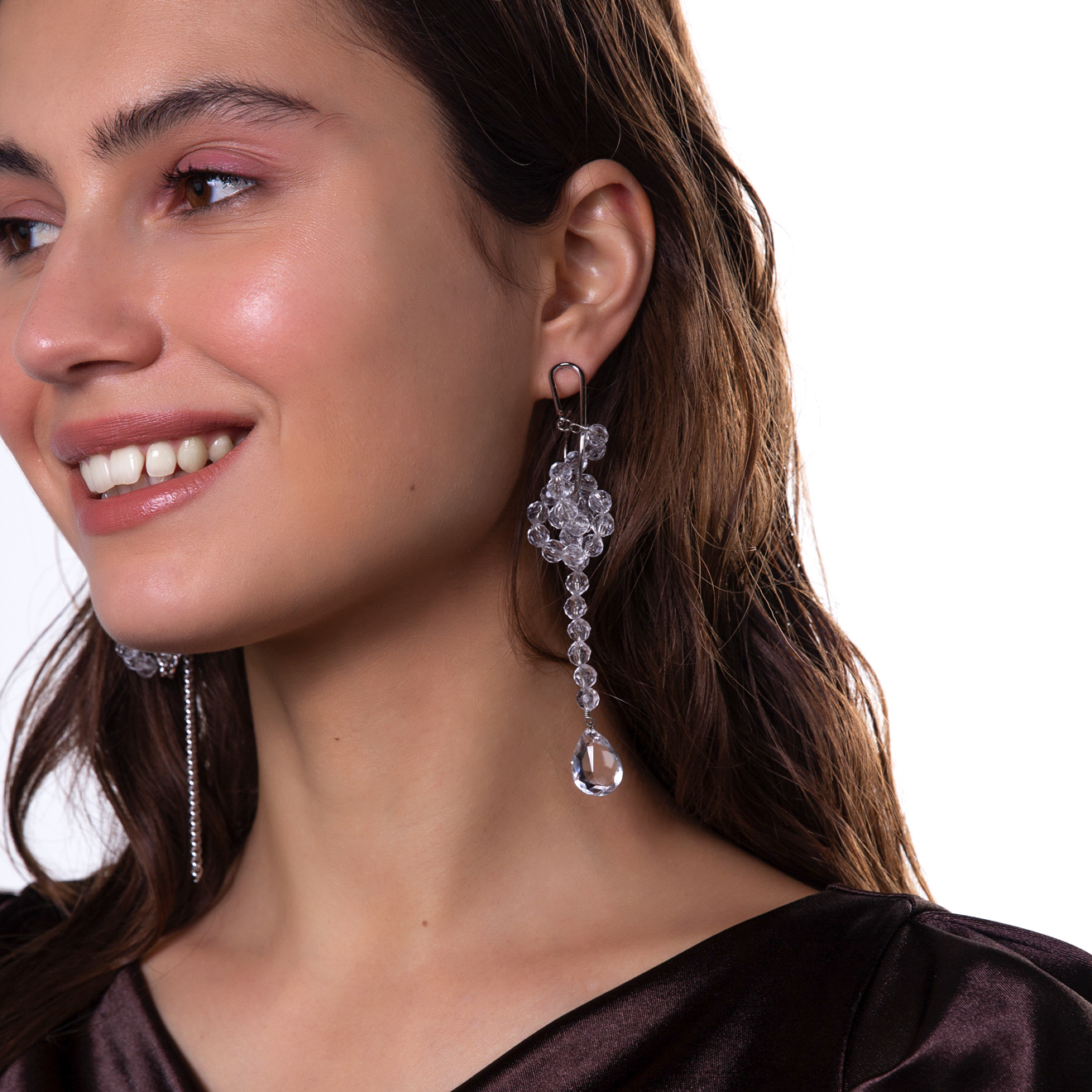 asymmetric earrings with chain pendants and crystals