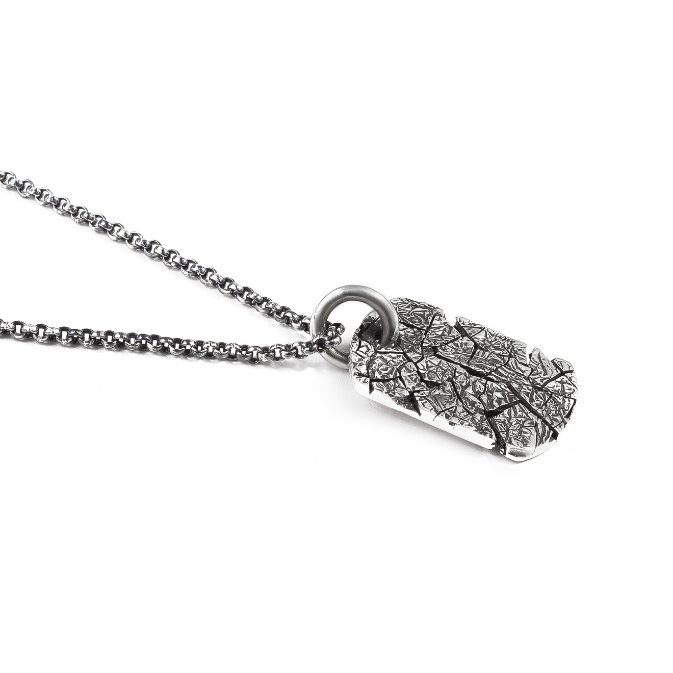 Pendant-token with cracks on a silver chain