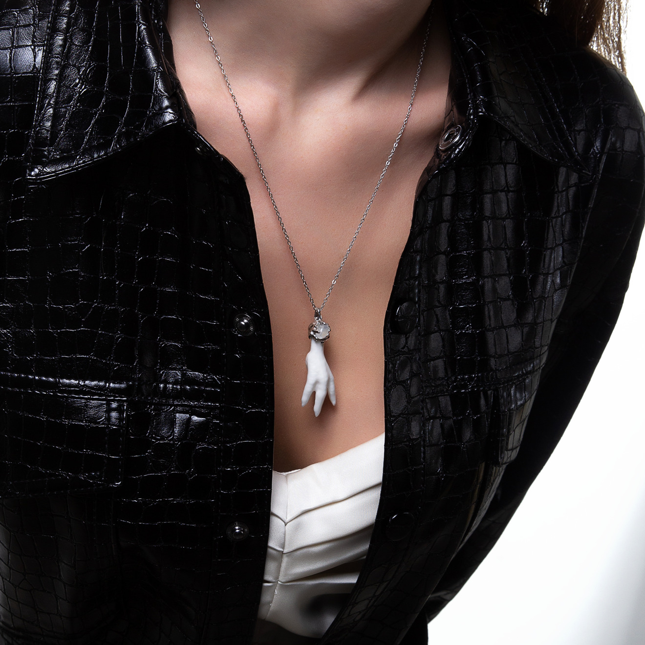Pendant-foot made of porcelain with a moonstone on a silver chain