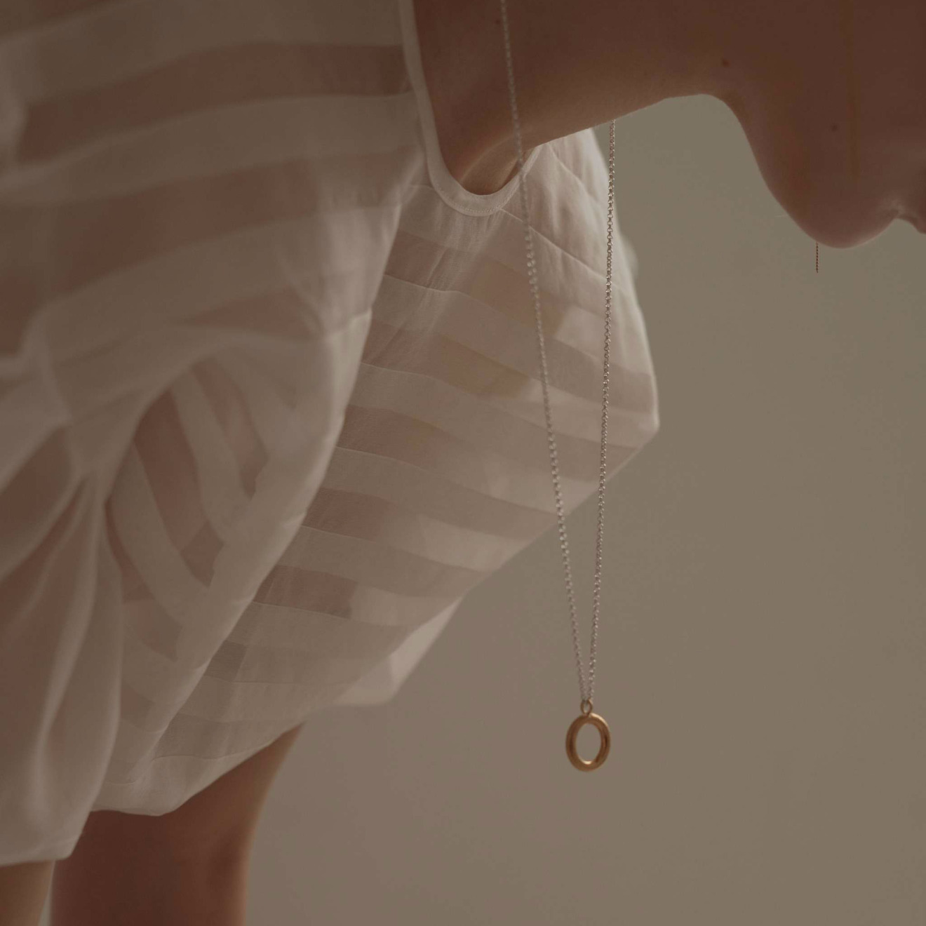 Gold-plated round Energy pendant on a silver chain