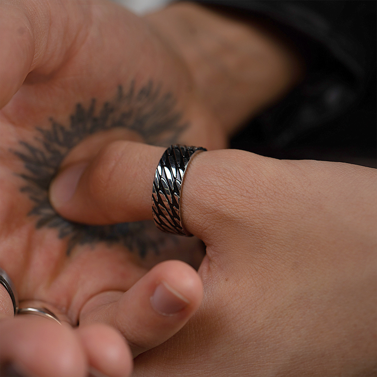 Wide steel ring with black stripes