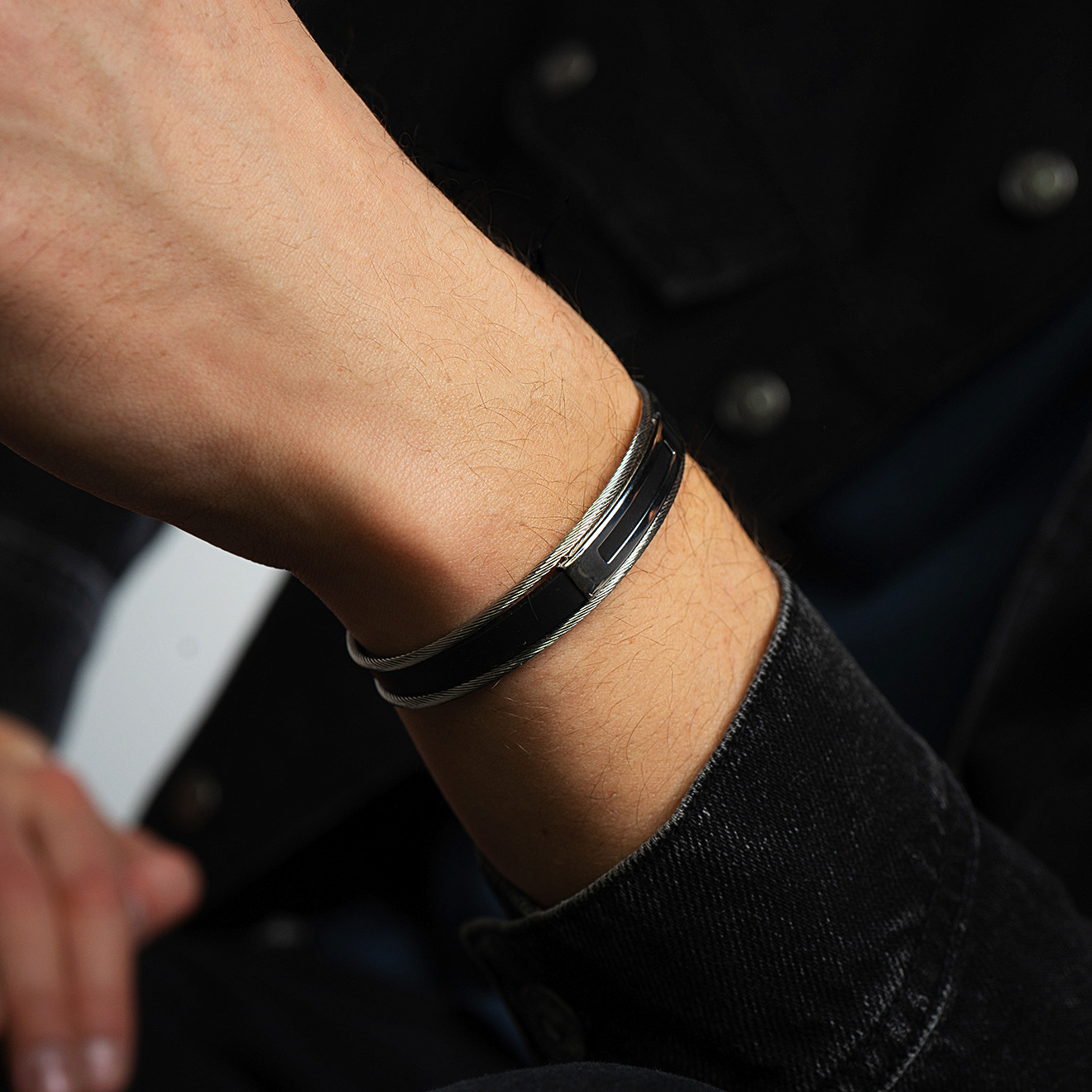 Black bracelet with steel cables