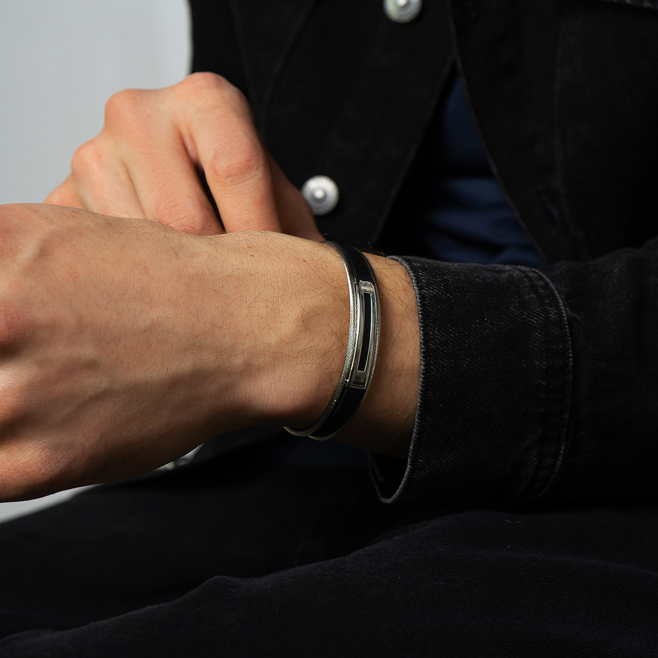 Black bracelet with steel cables