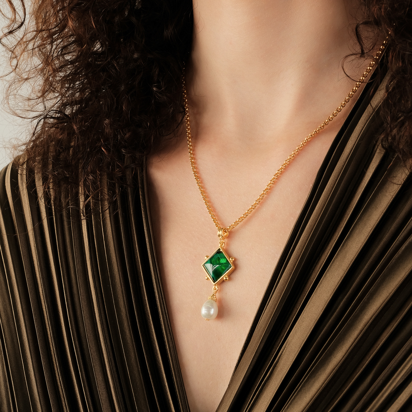 Gold-plated Grey necklace with a pendant made of green Czech crystal with a pearl drop pendant