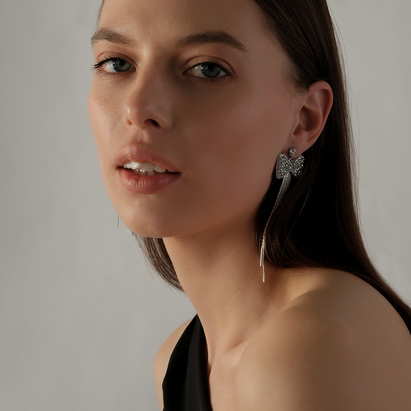 bow earrings with crystals and chains