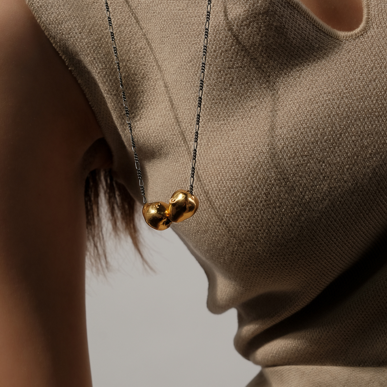 Black chain with gold-plated silver pendants