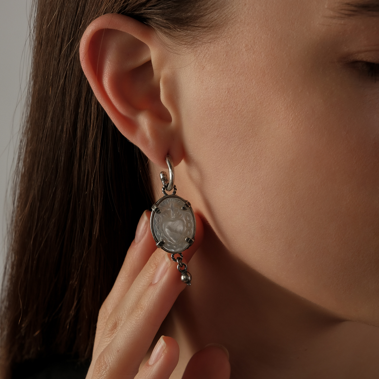 silver earrings with blue glass inserts