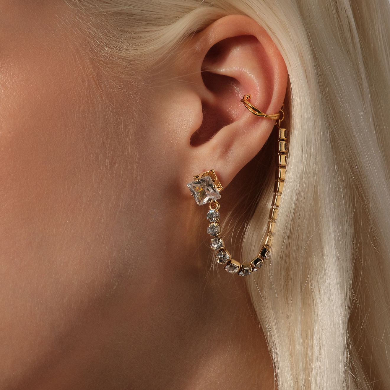 stud earrings with crystals and a cuff pendant