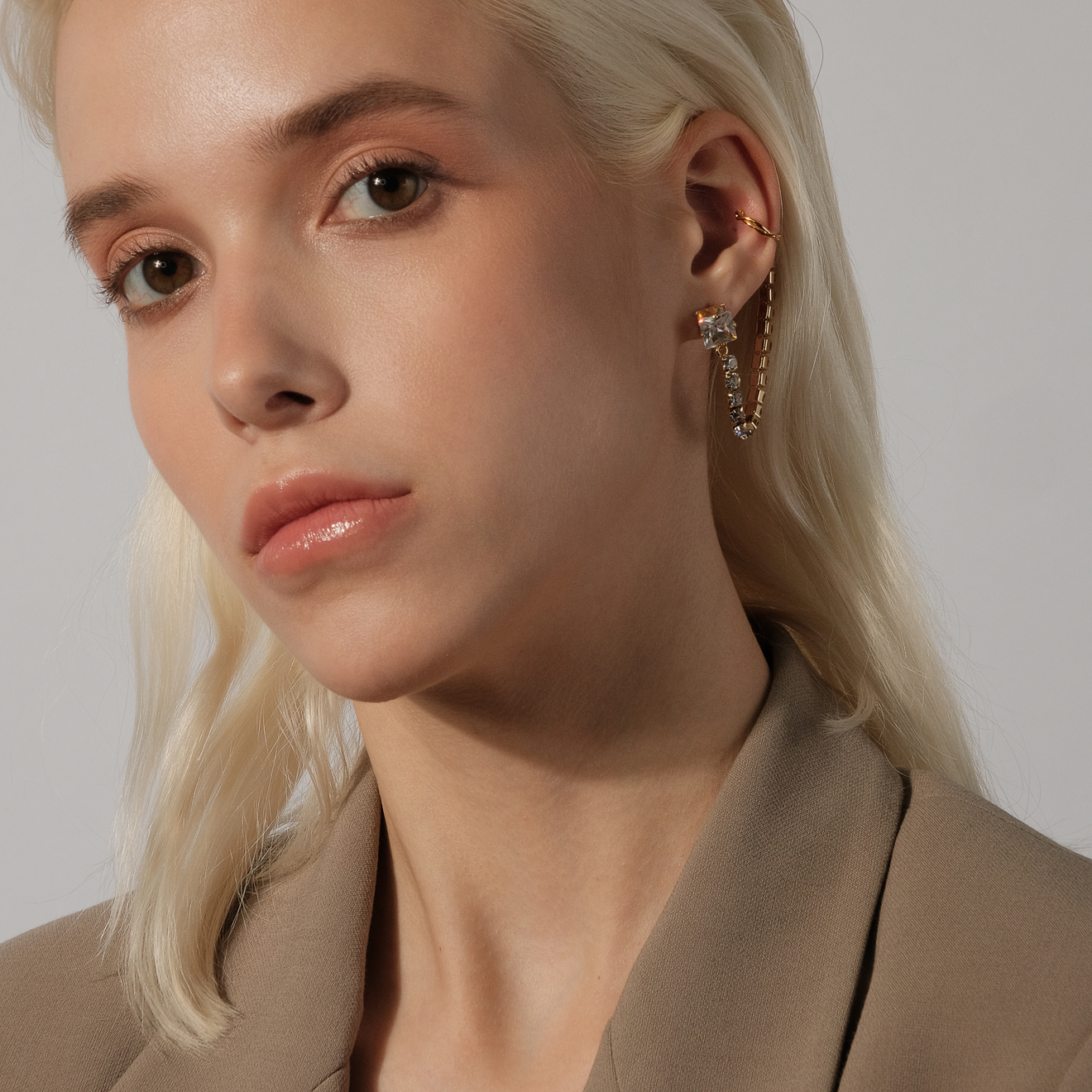 stud earrings with crystals and a cuff pendant