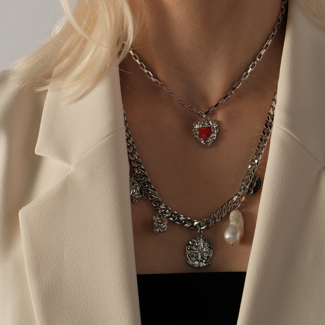 Necklace with baroque pearls and a red heart