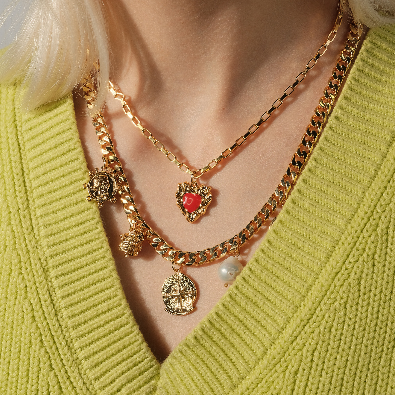 necklace with medallions and a red heart