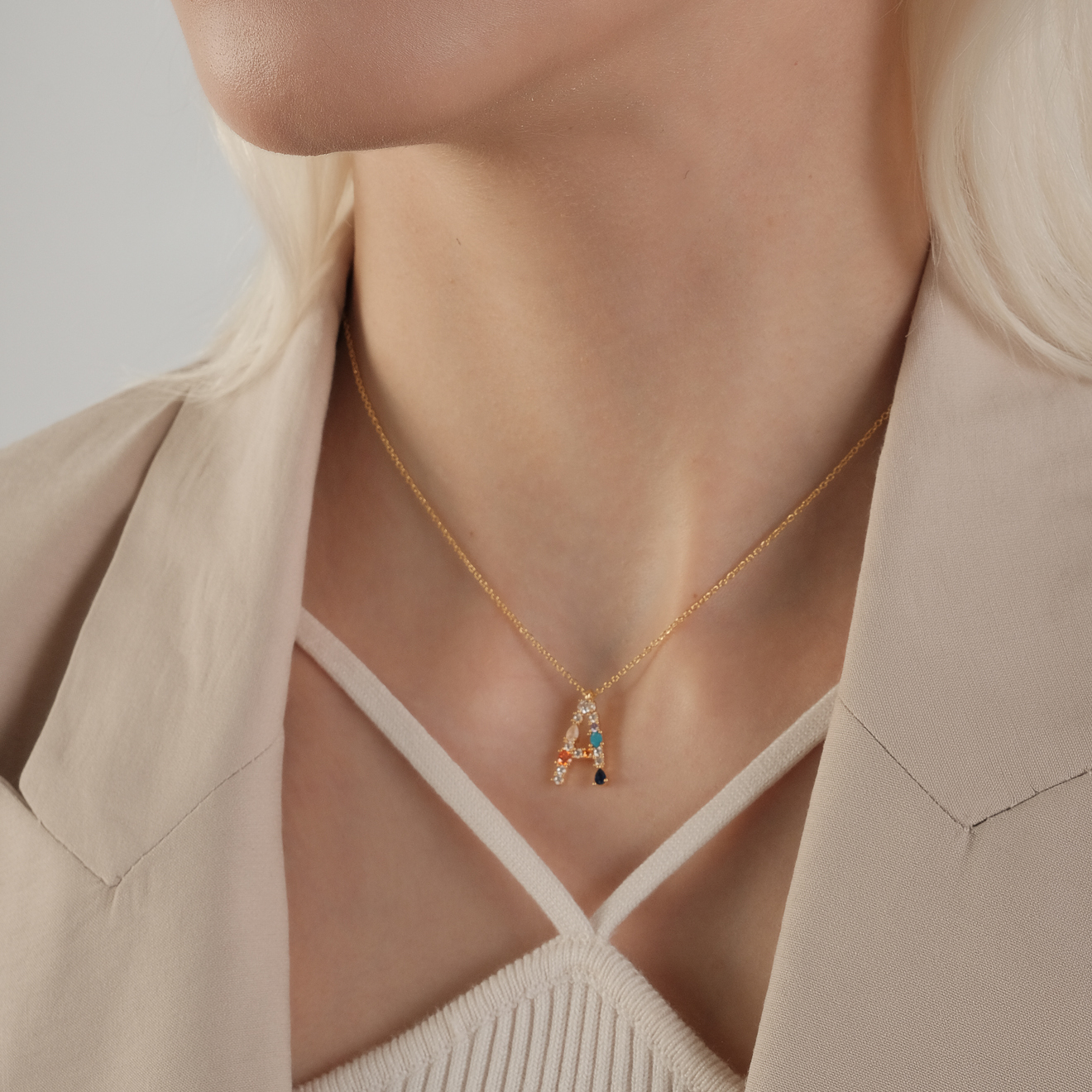 pendant with the letter A made of colored crystals