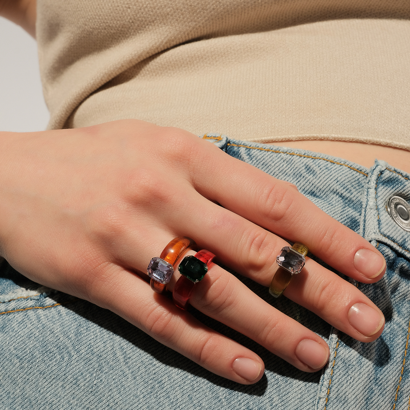 Ring made of light green plastic with a purple stone