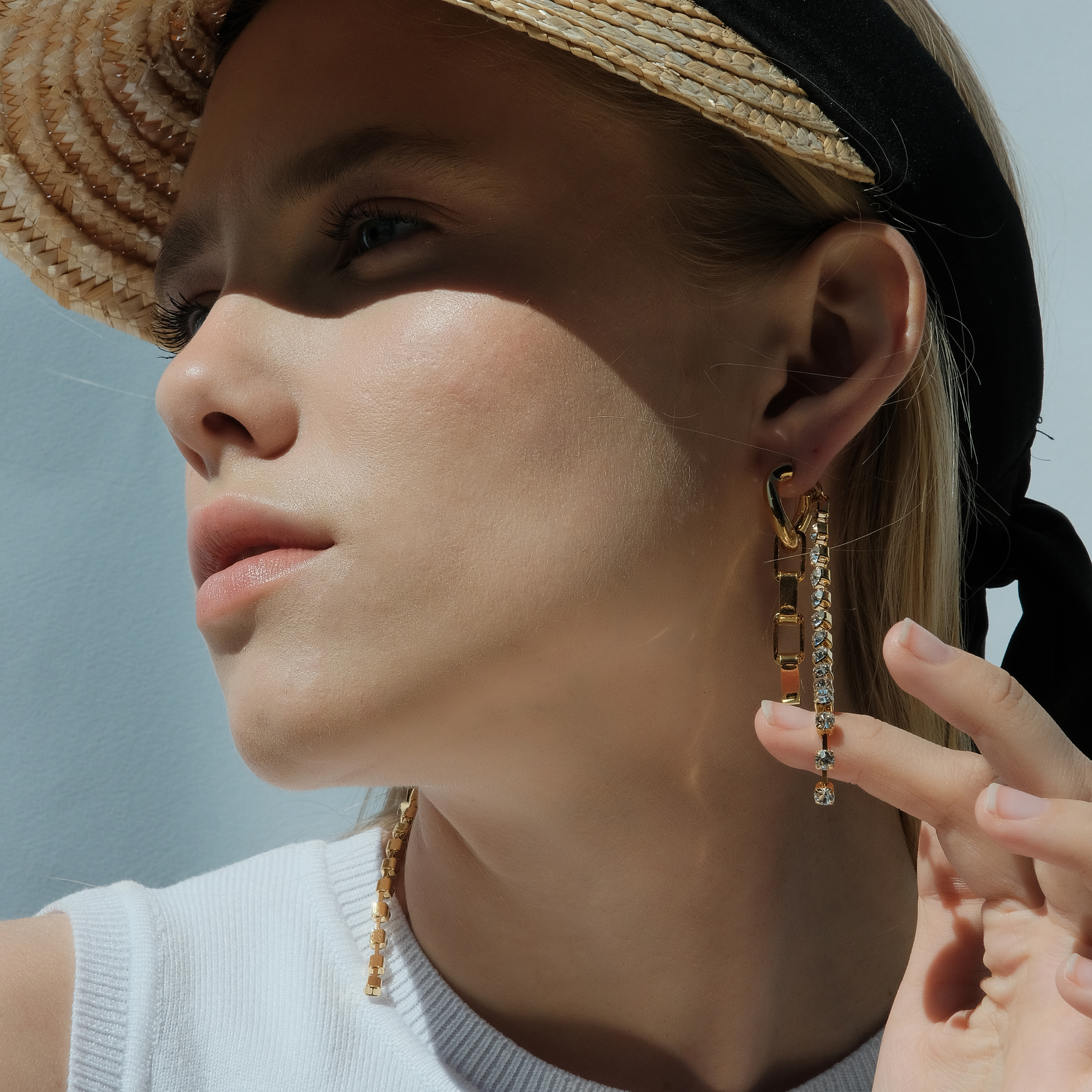 earrings with a chain and crystals