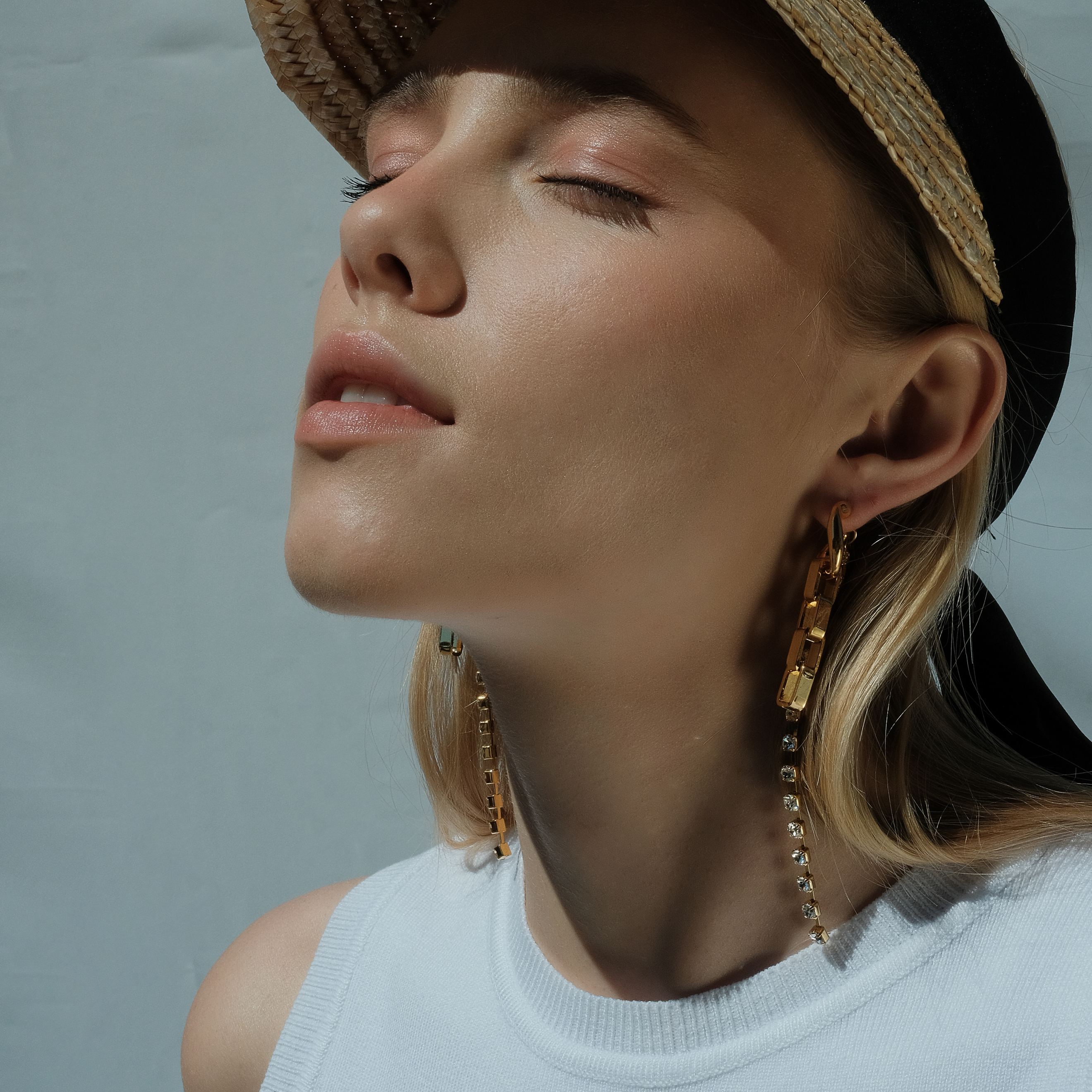 earrings with a chain and crystals