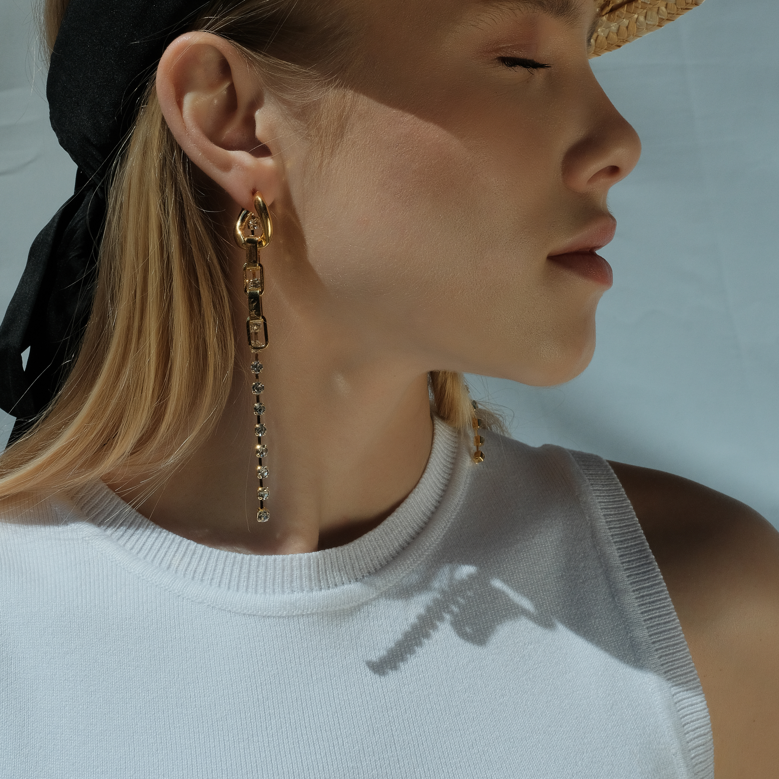 earrings with a chain and crystals
