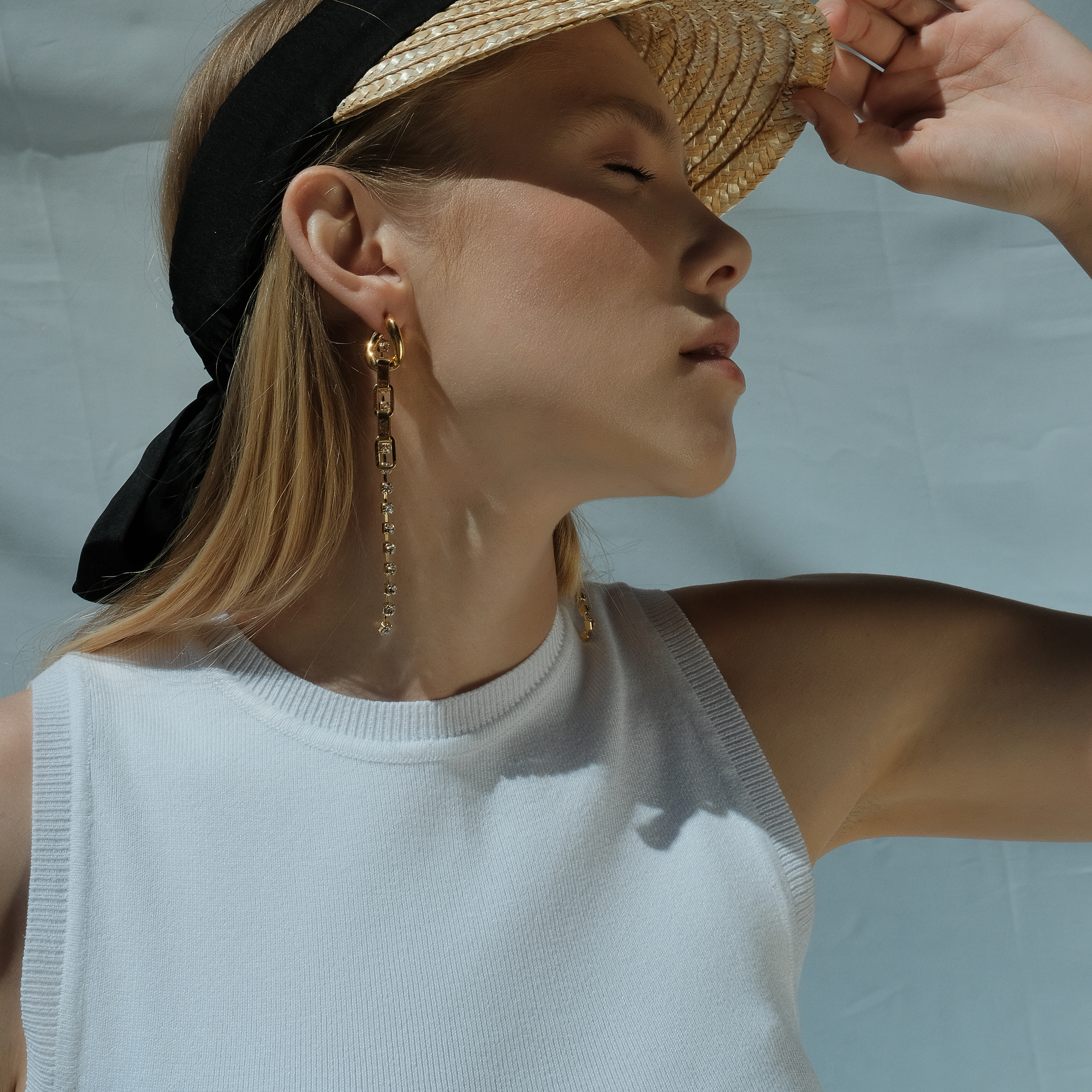 earrings with a chain and crystals