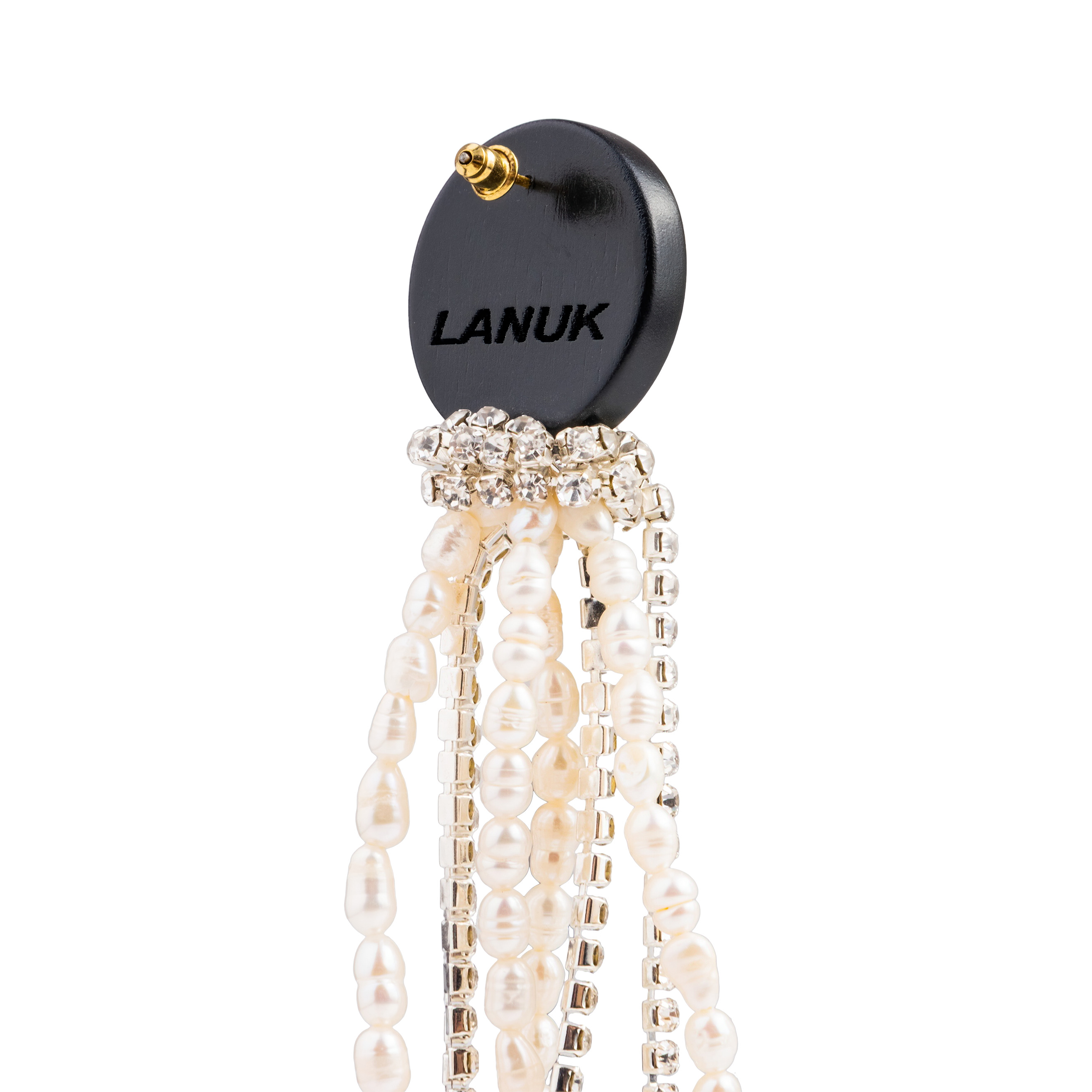 Black circle earrings made of wood with cascading pendants made of colored crystals and pearls