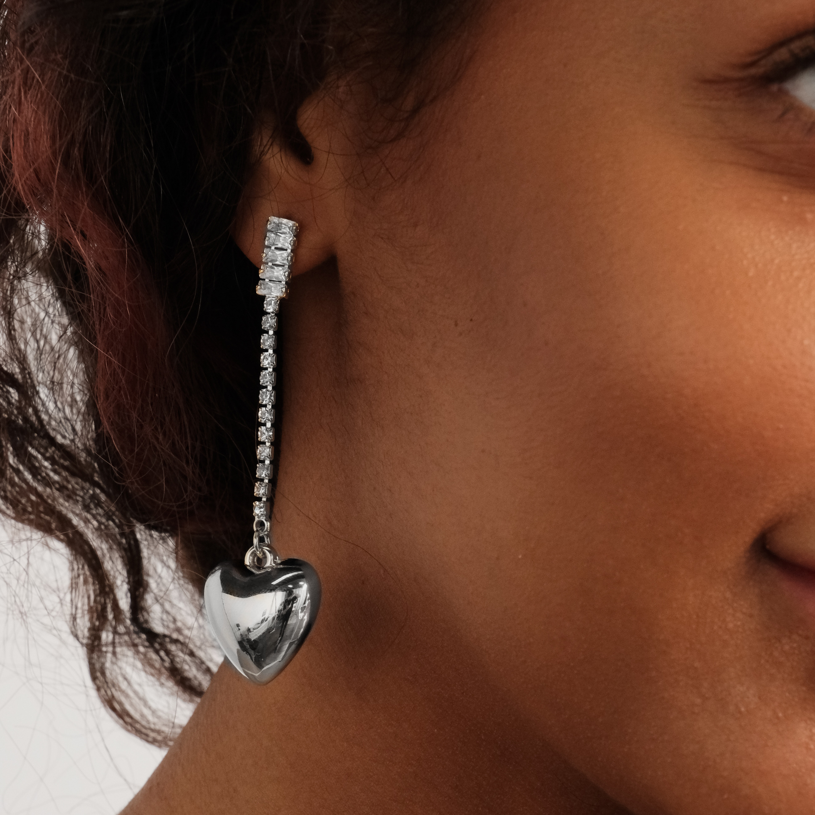 asymmetric earrings with crystals and hearts