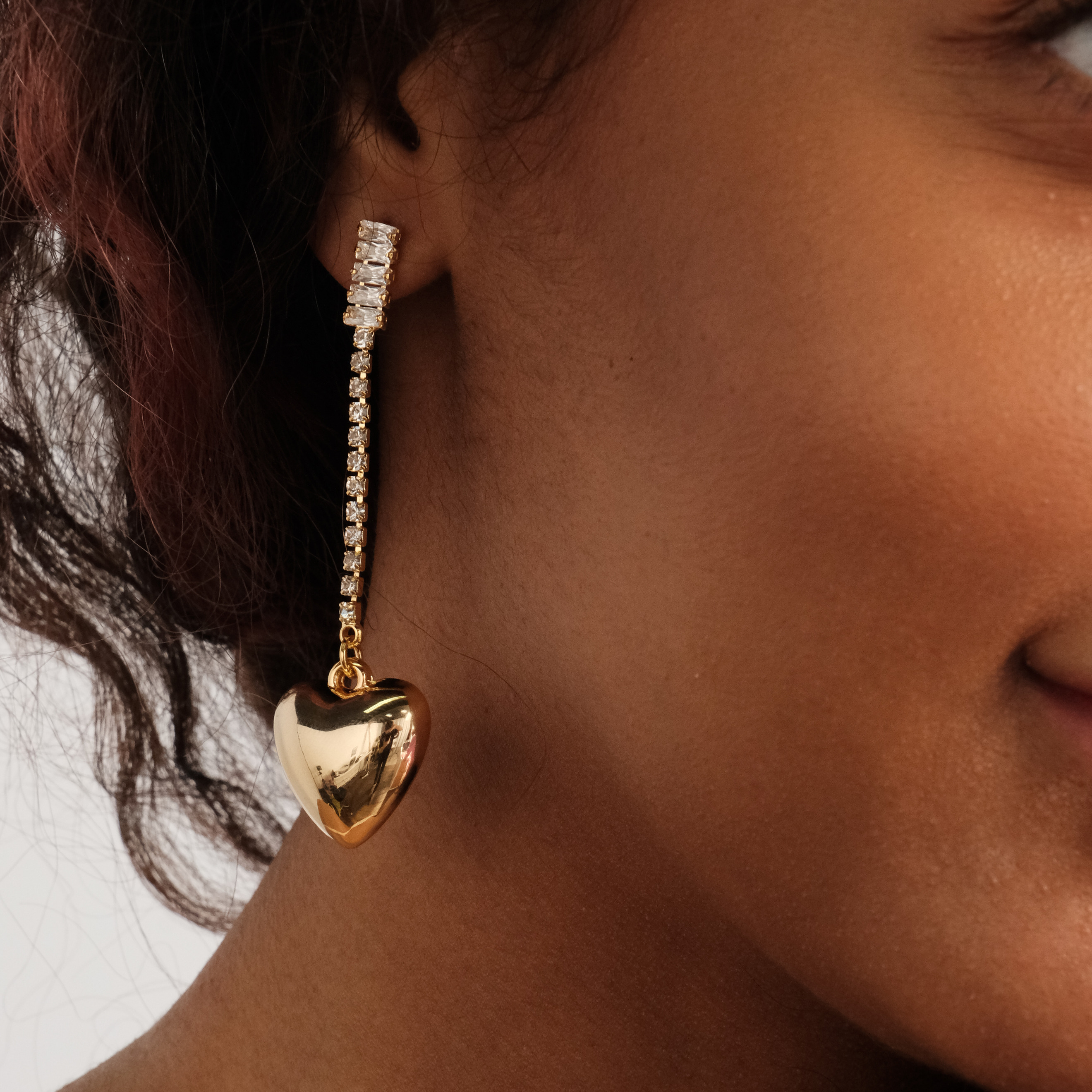 asymmetric earrings with crystals and hearts