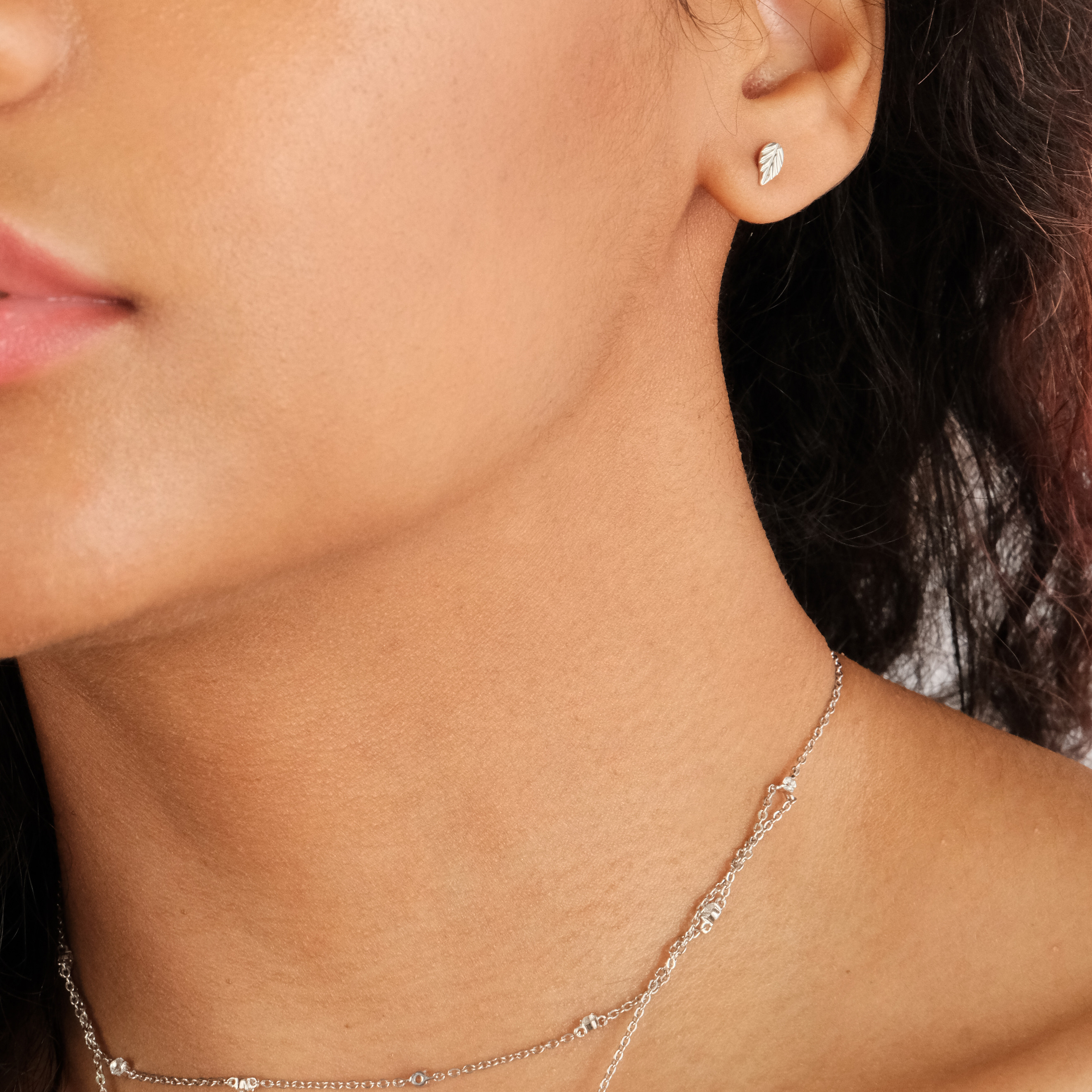 single pull-through earring and single stud earring «Listici» in silver