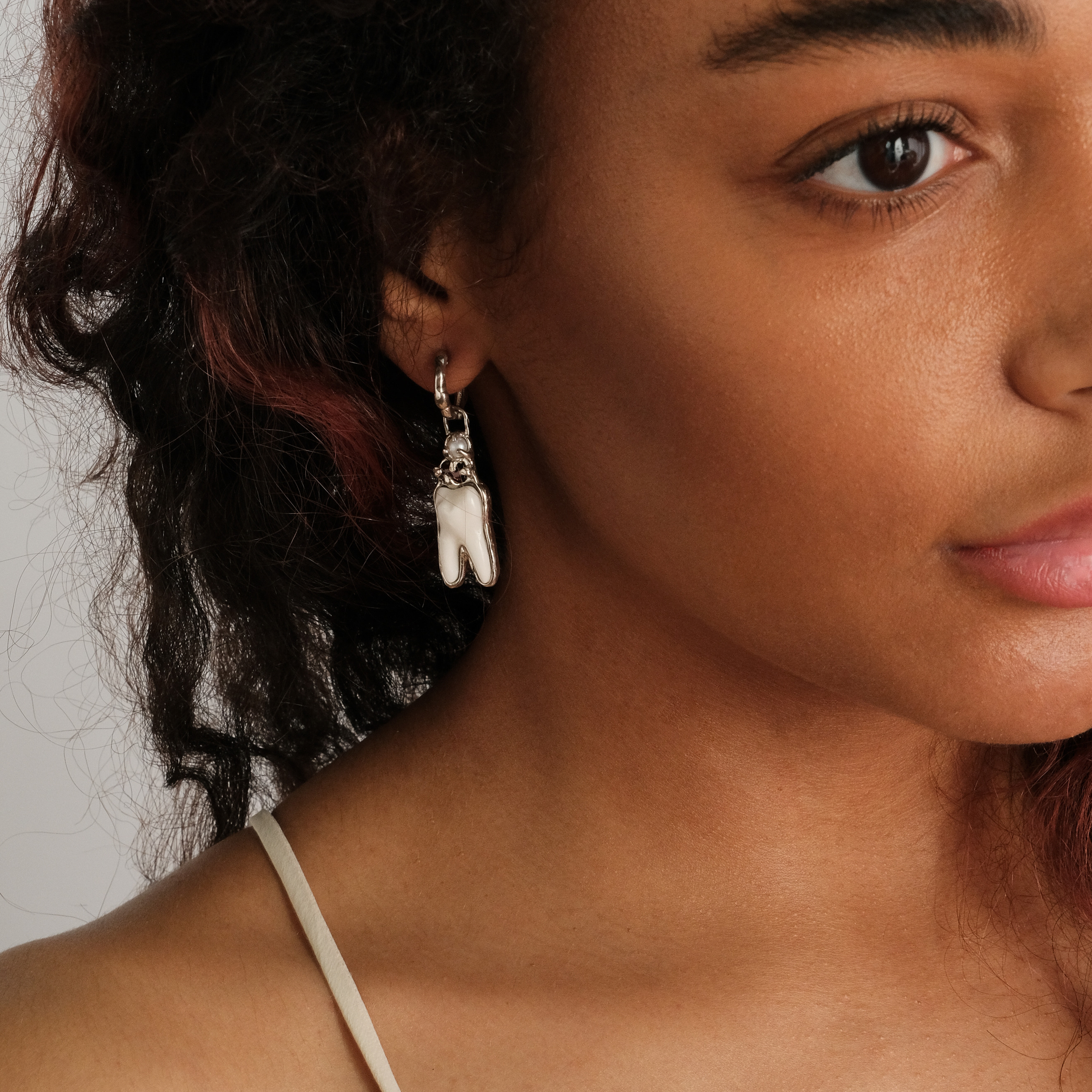 white brass teeth earrings