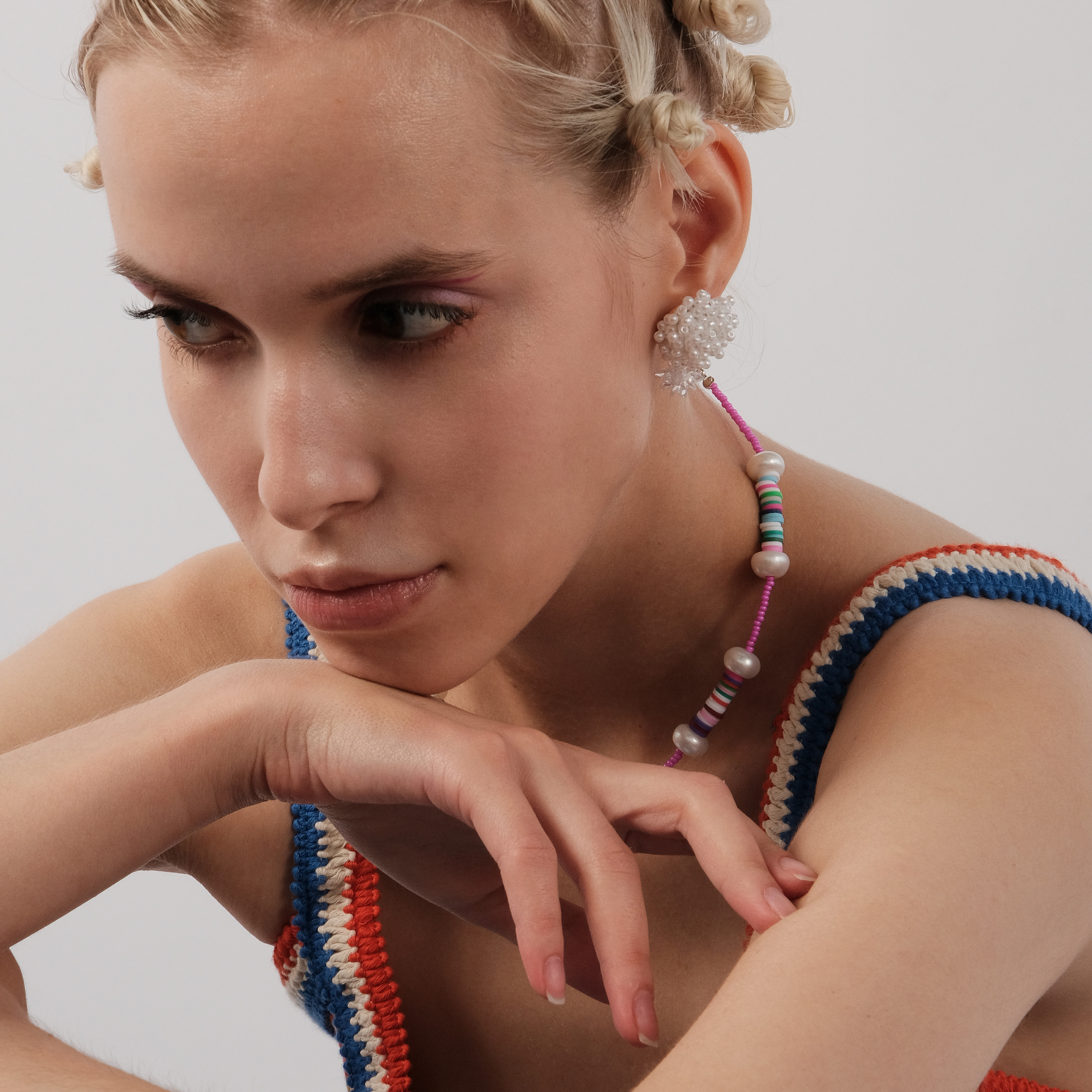 Pearl bead earrings with a white flower