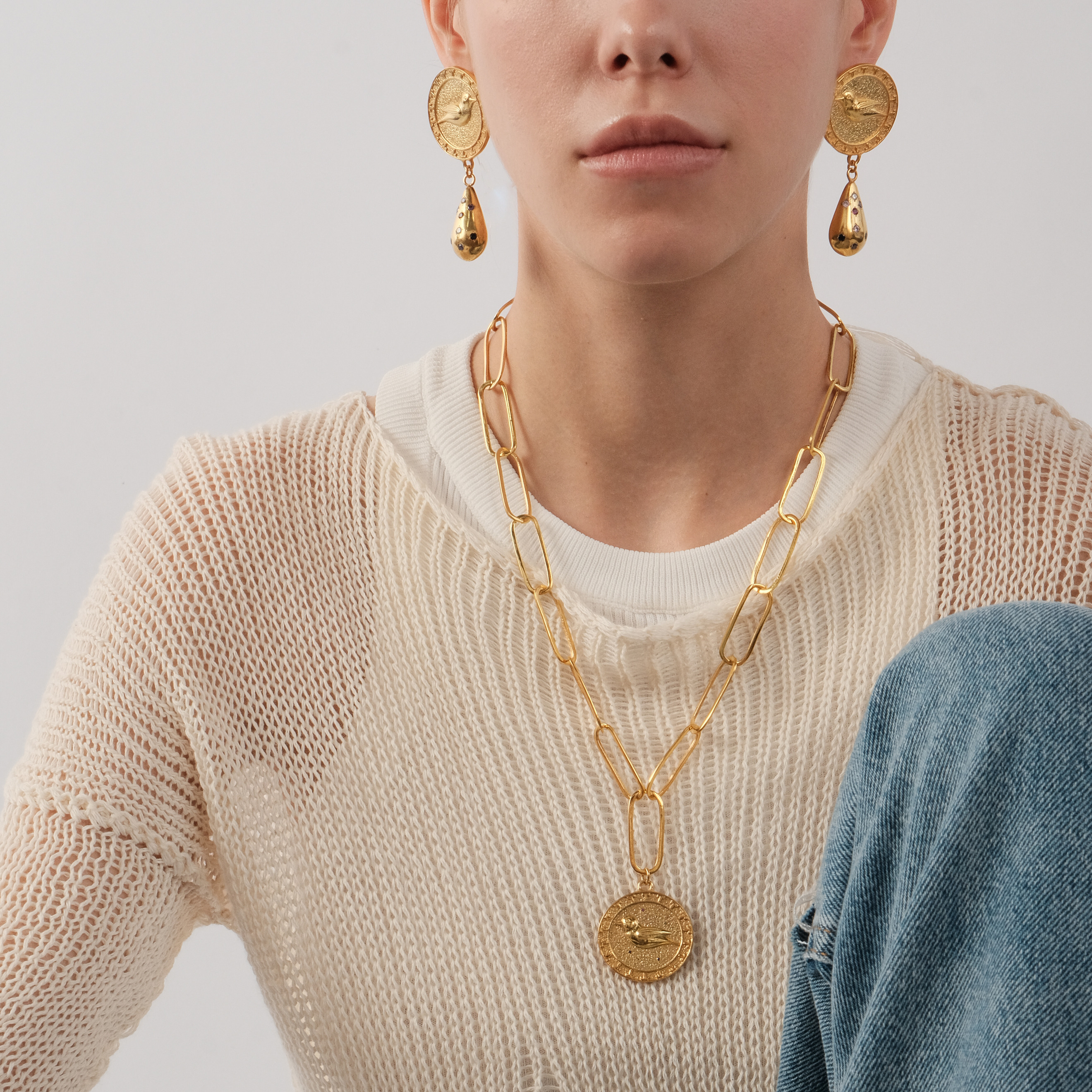 Gold-plated round earrings with birds and droplets with inserts of multicolored zirconium