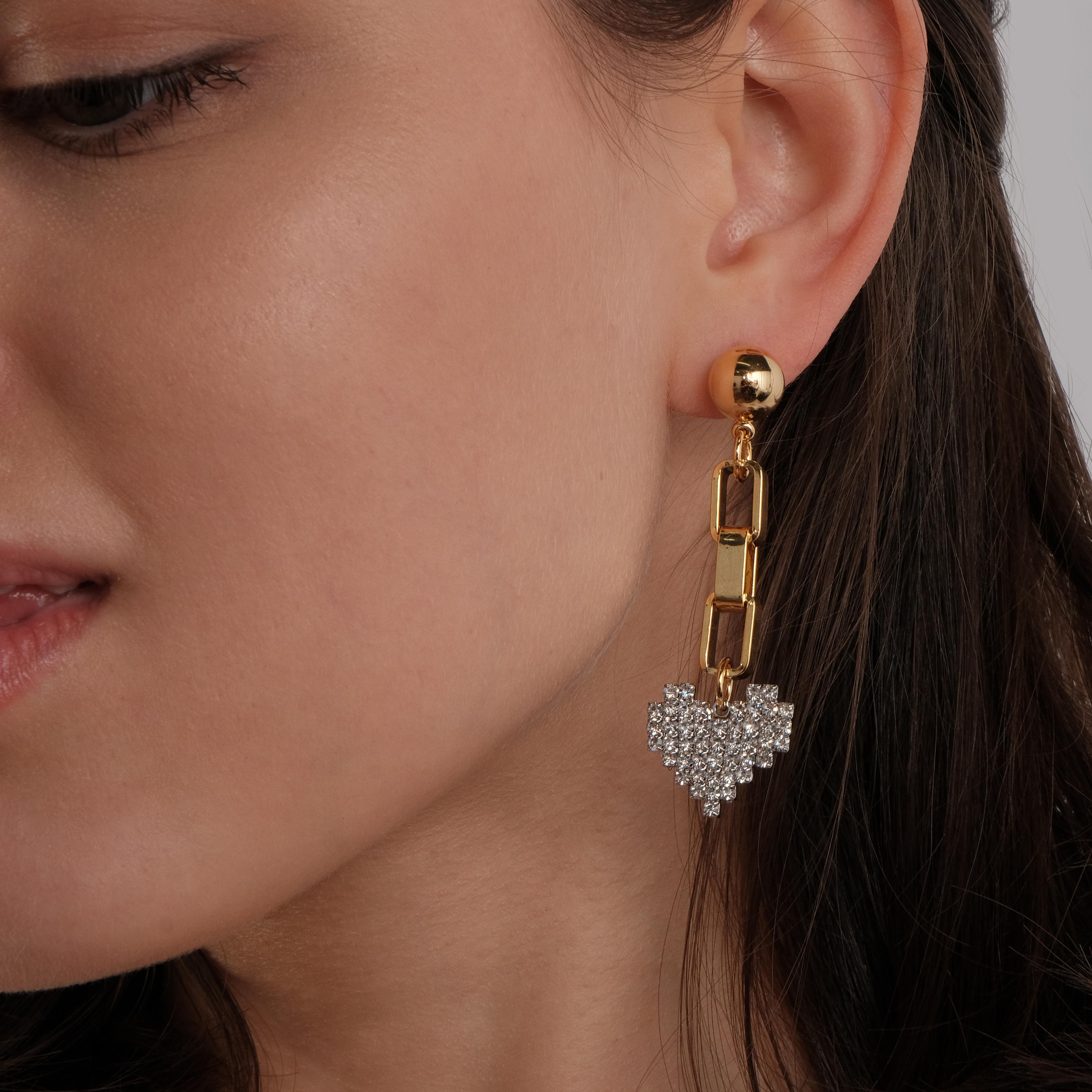earrings with a silver heart with crystals and a circle