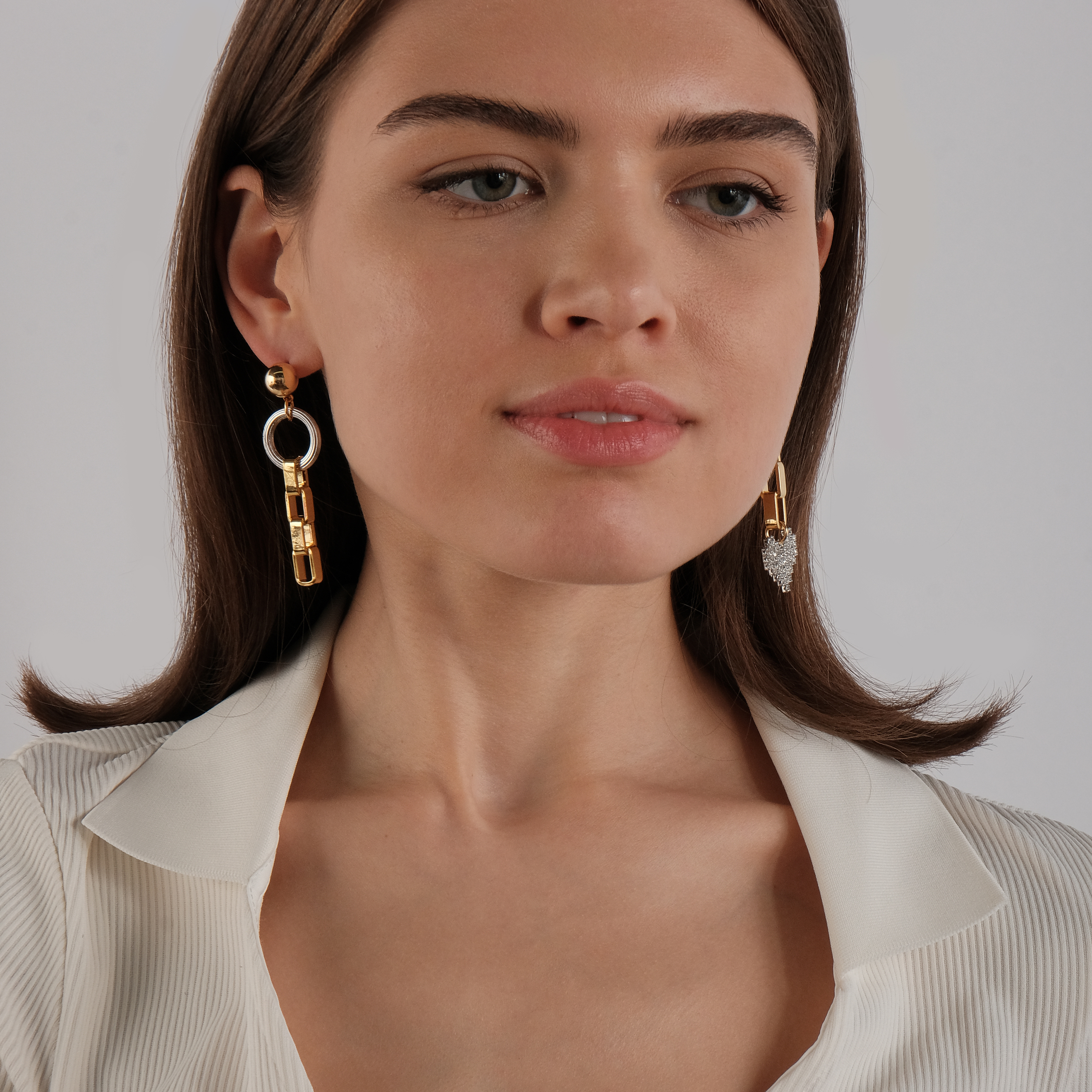 earrings with a silver heart with crystals and a circle