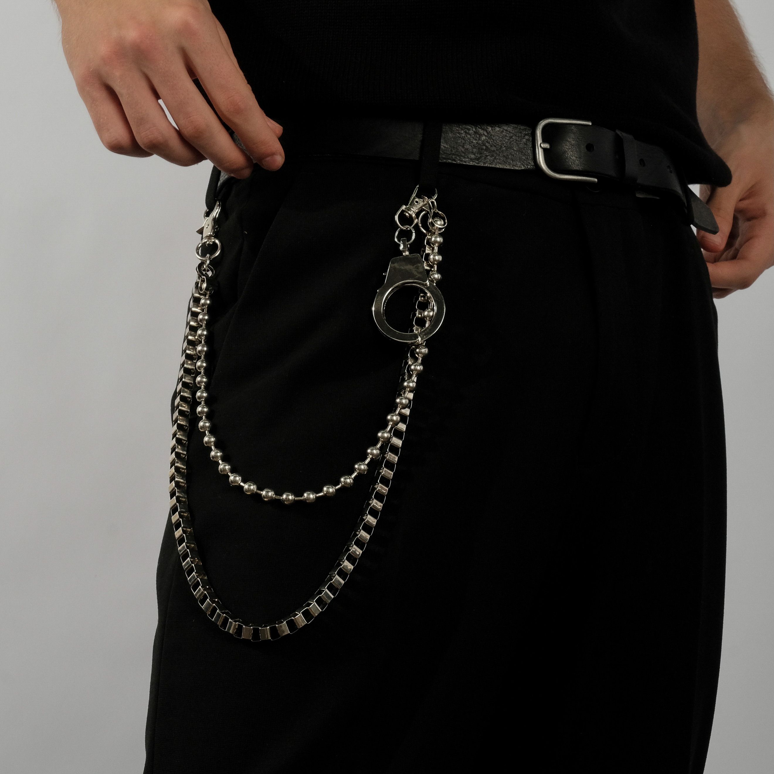 Double chain on trousers with steel handcuff
