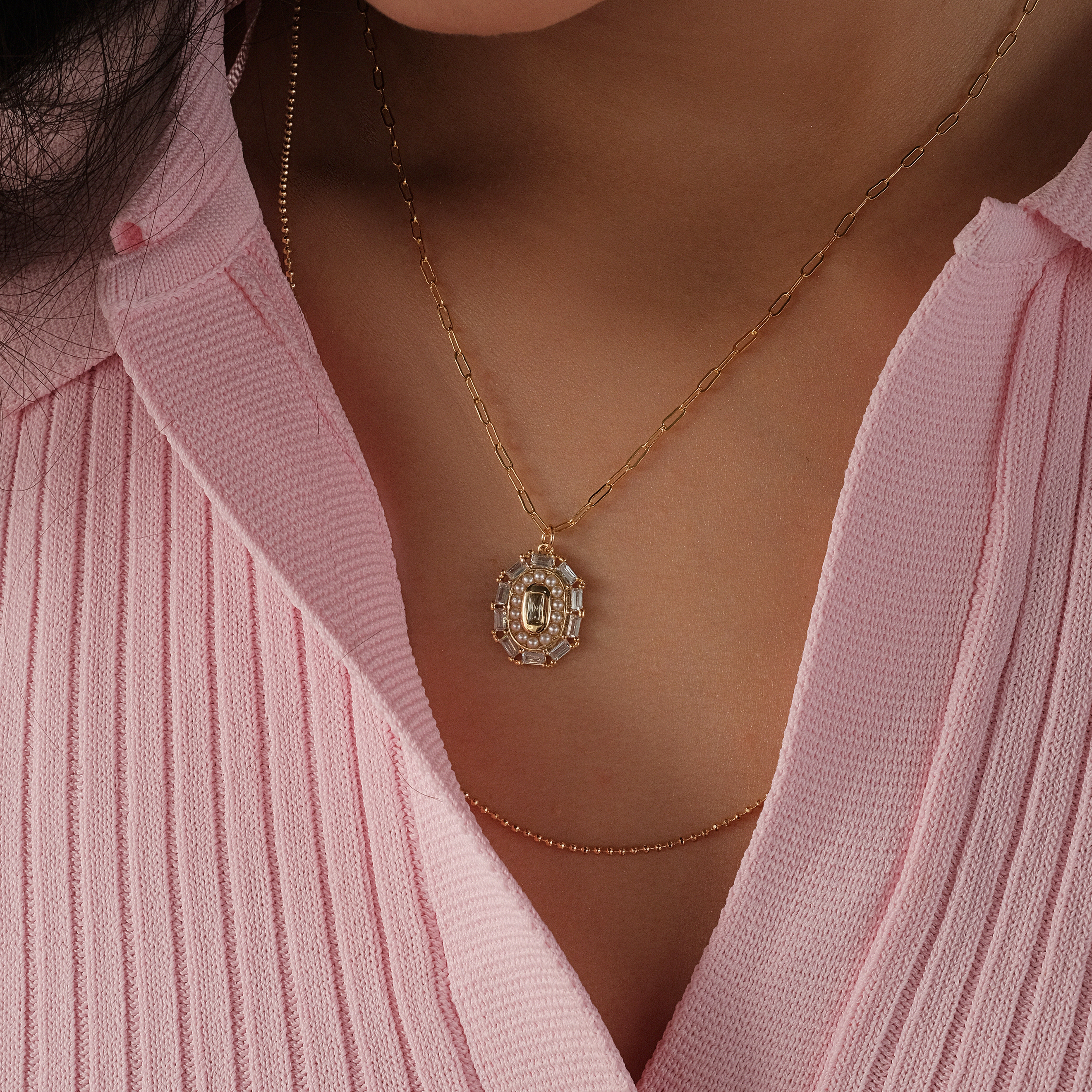double necklace with a large medallion