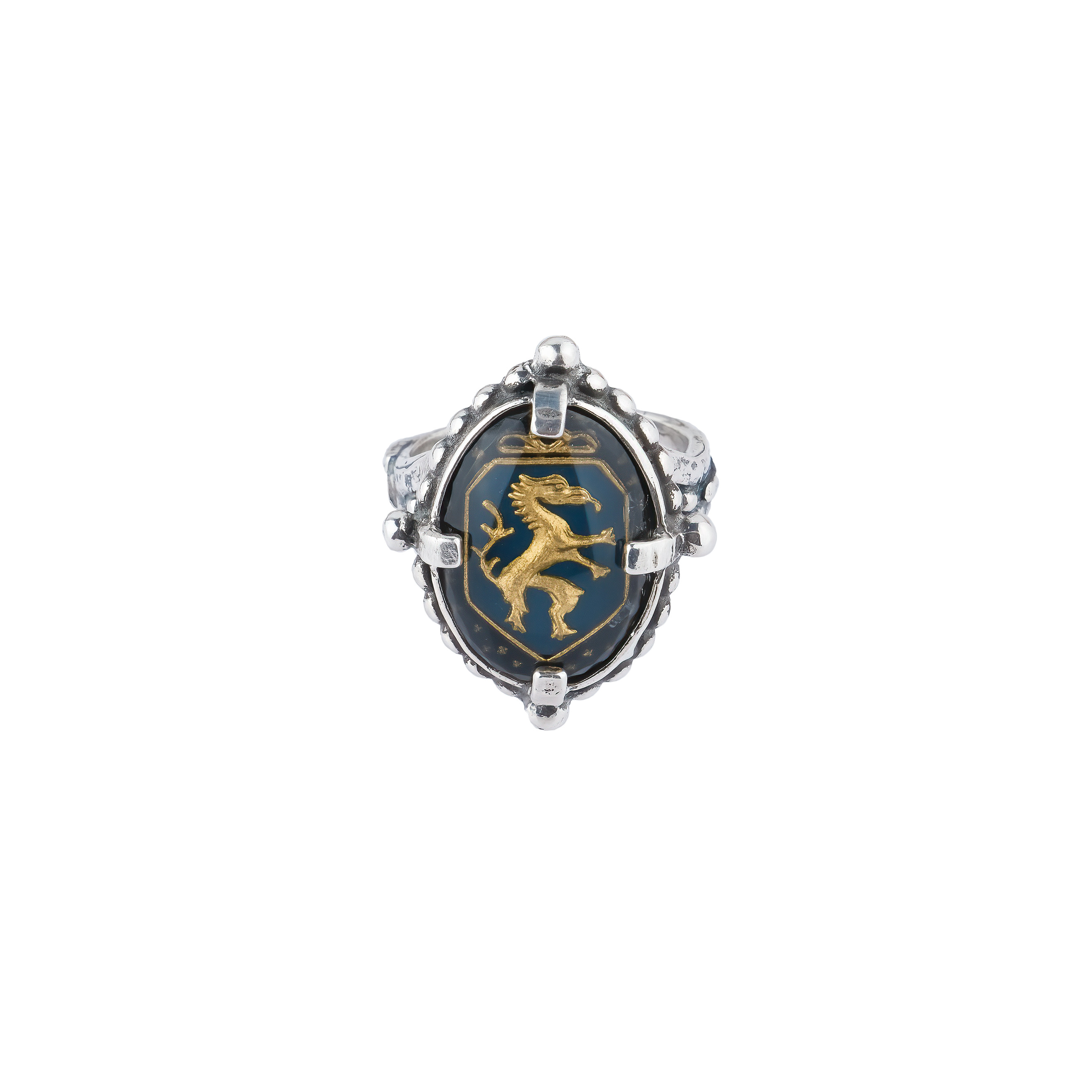 Silver ring with carved black crystal and dragon pattern