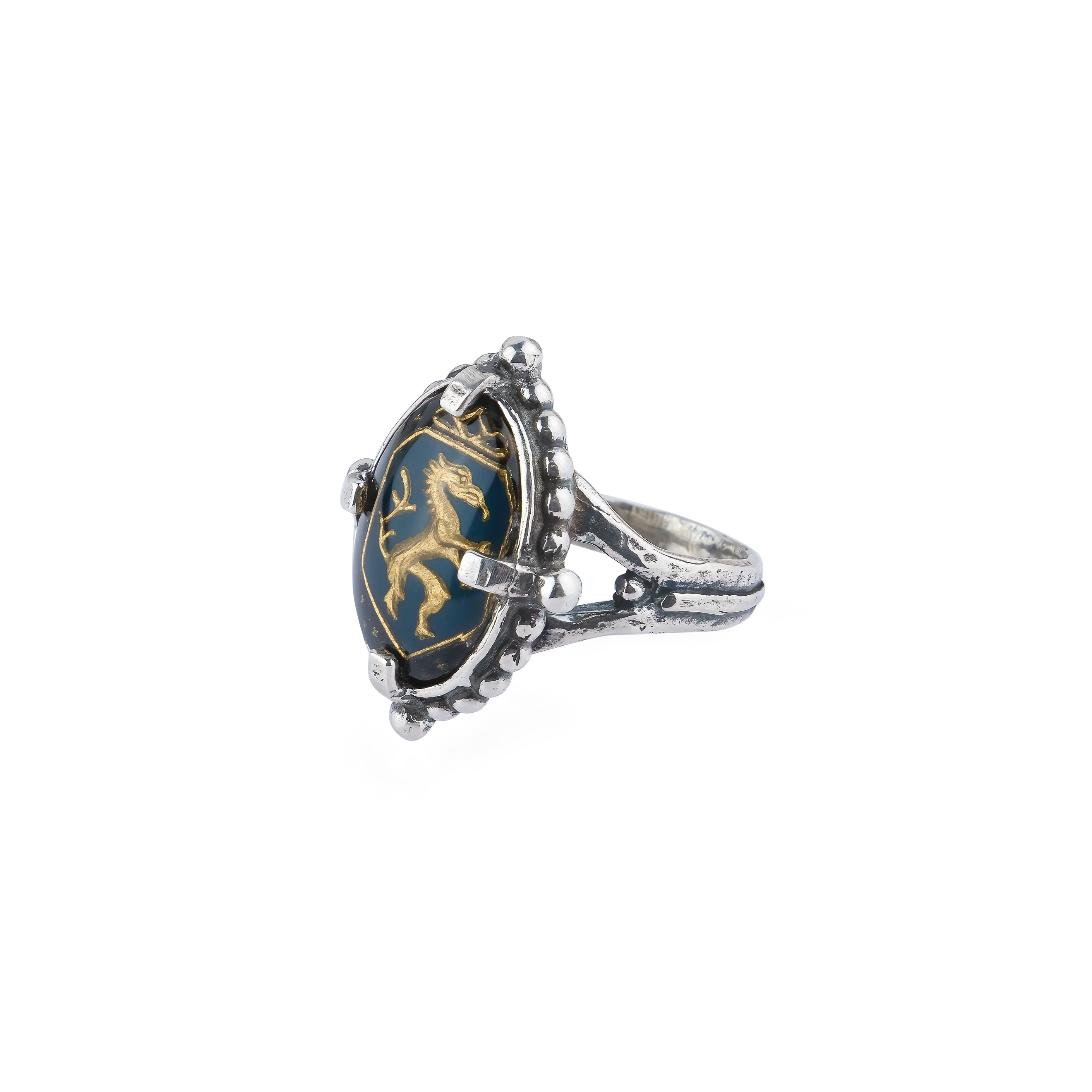 Silver ring with carved black crystal and dragon pattern