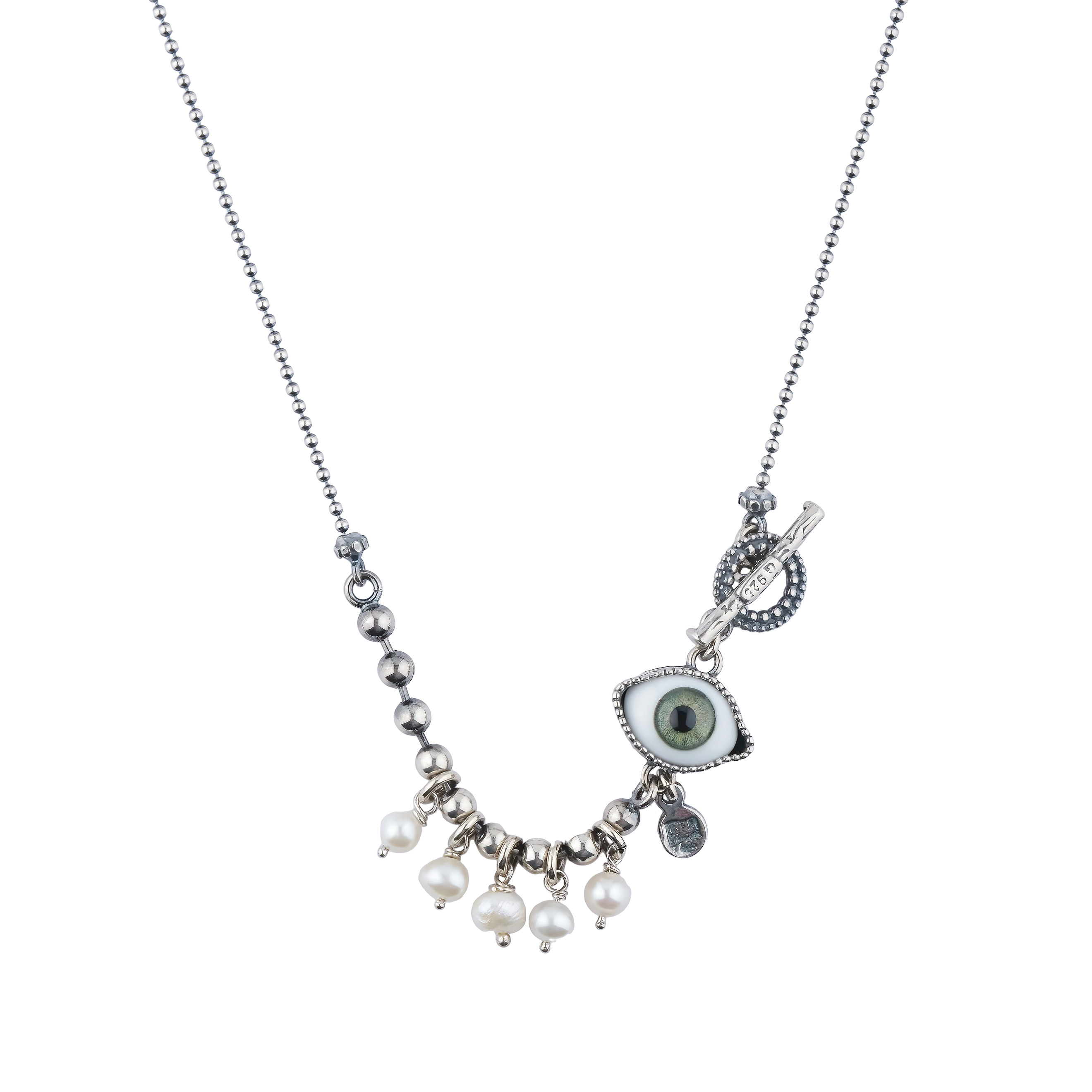 Silver medallion with an eye and pearls