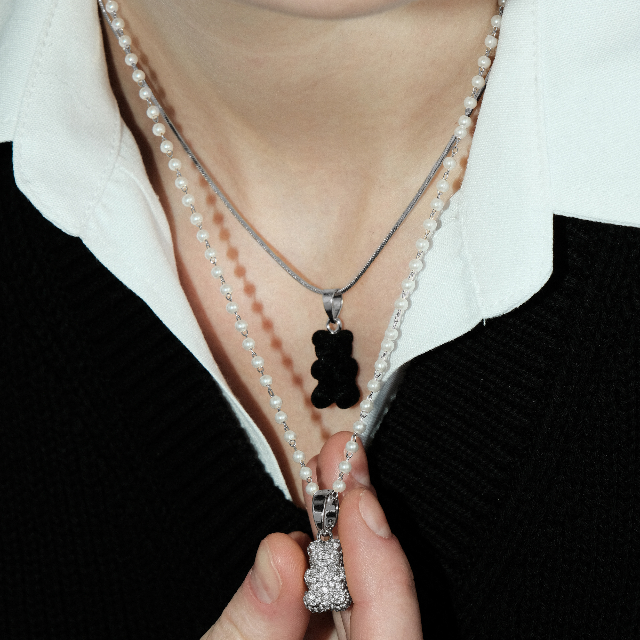 Necklace with pearls and a bear pendant with crystals